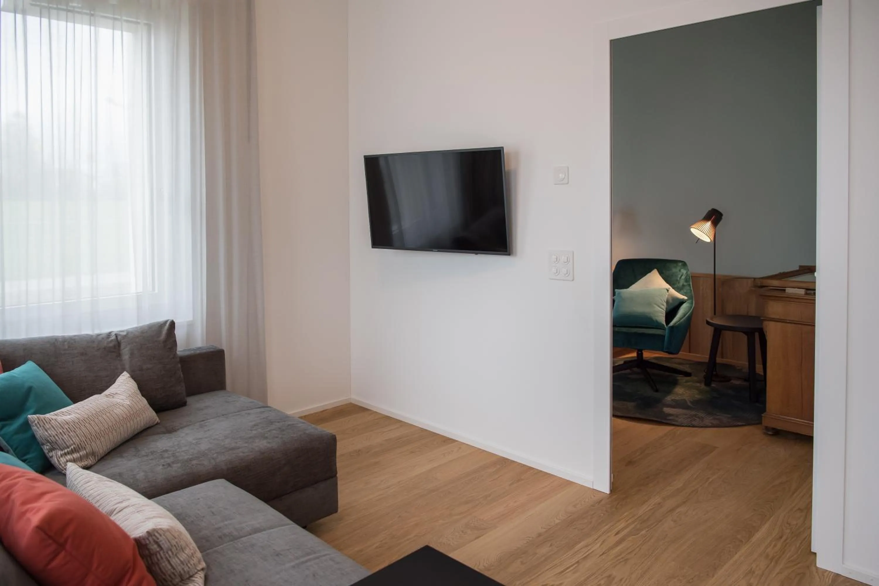 Communal lounge/ TV room in Aparthotel Luzern West