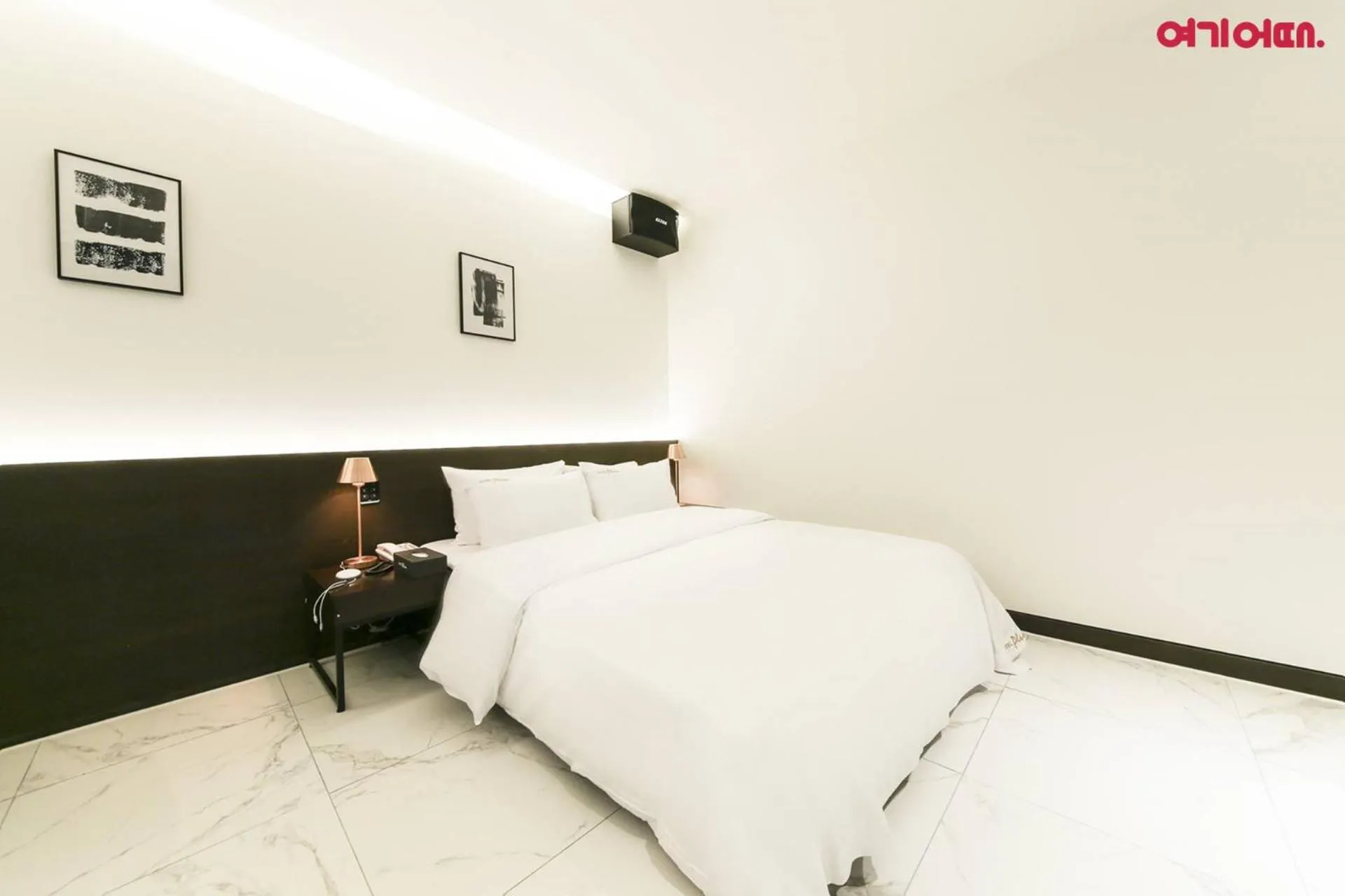 Bed in Plum Hotel