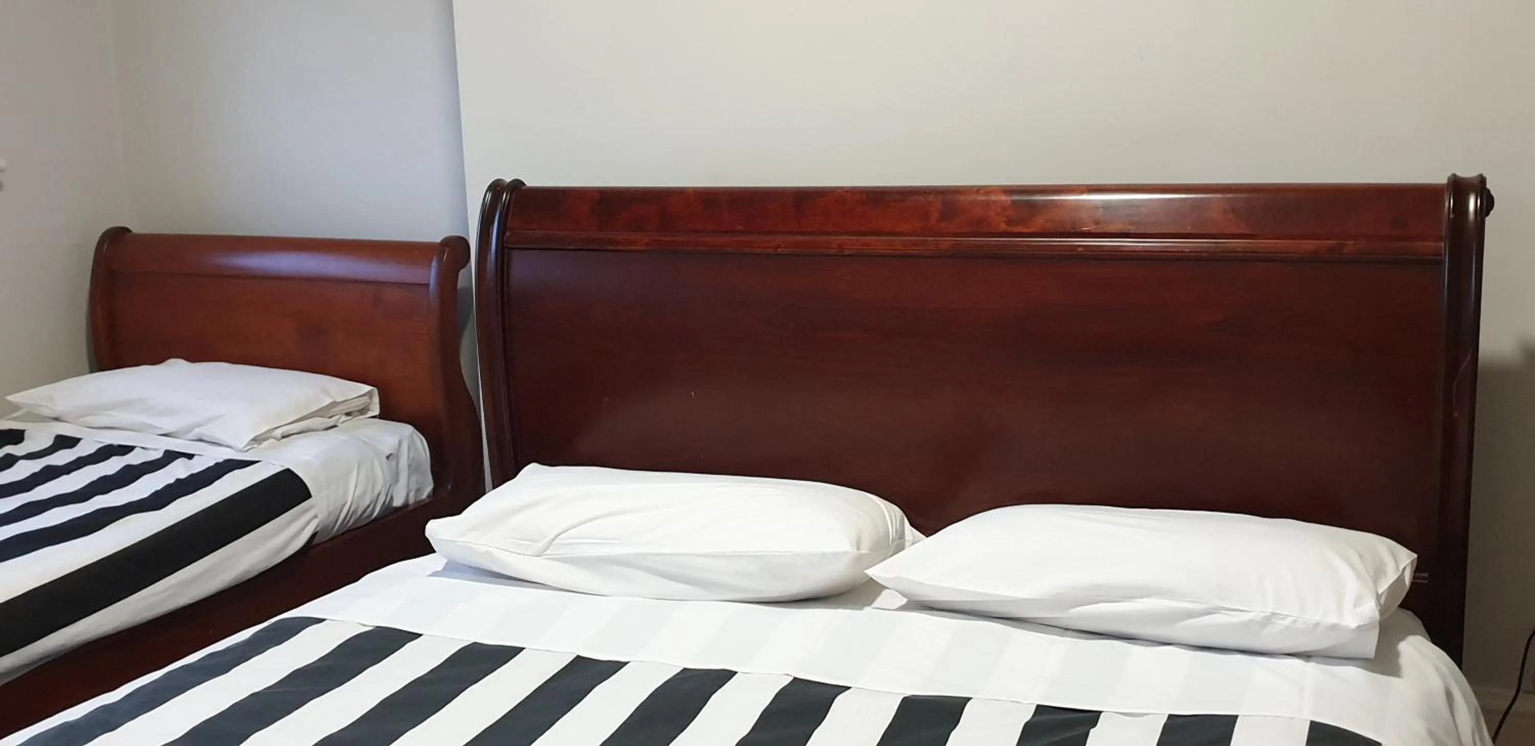 Bed in The Eastern Hotel Accommodation