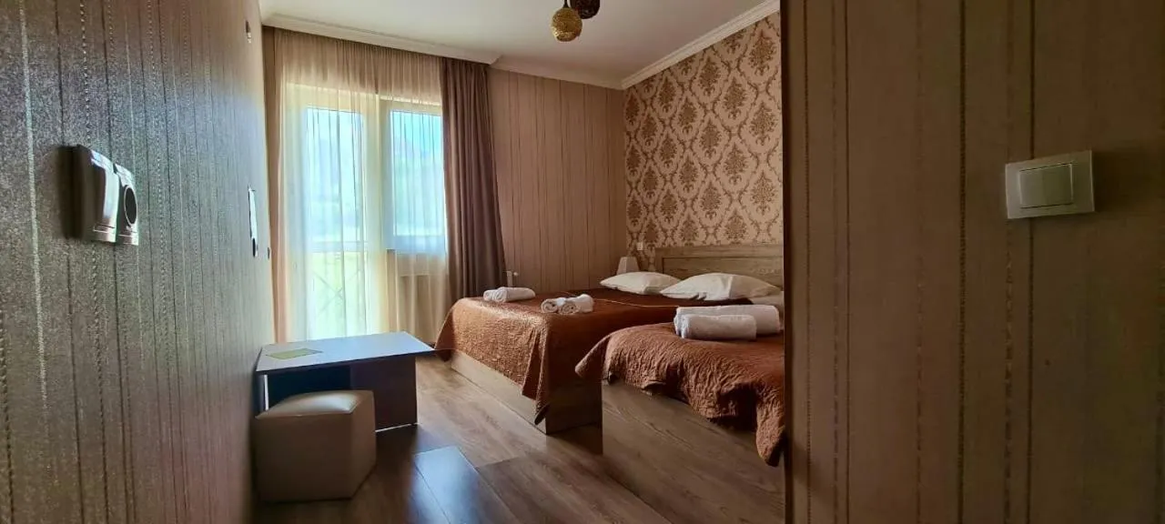 Communal lounge/ TV room, Bed in Kazbegi Inn