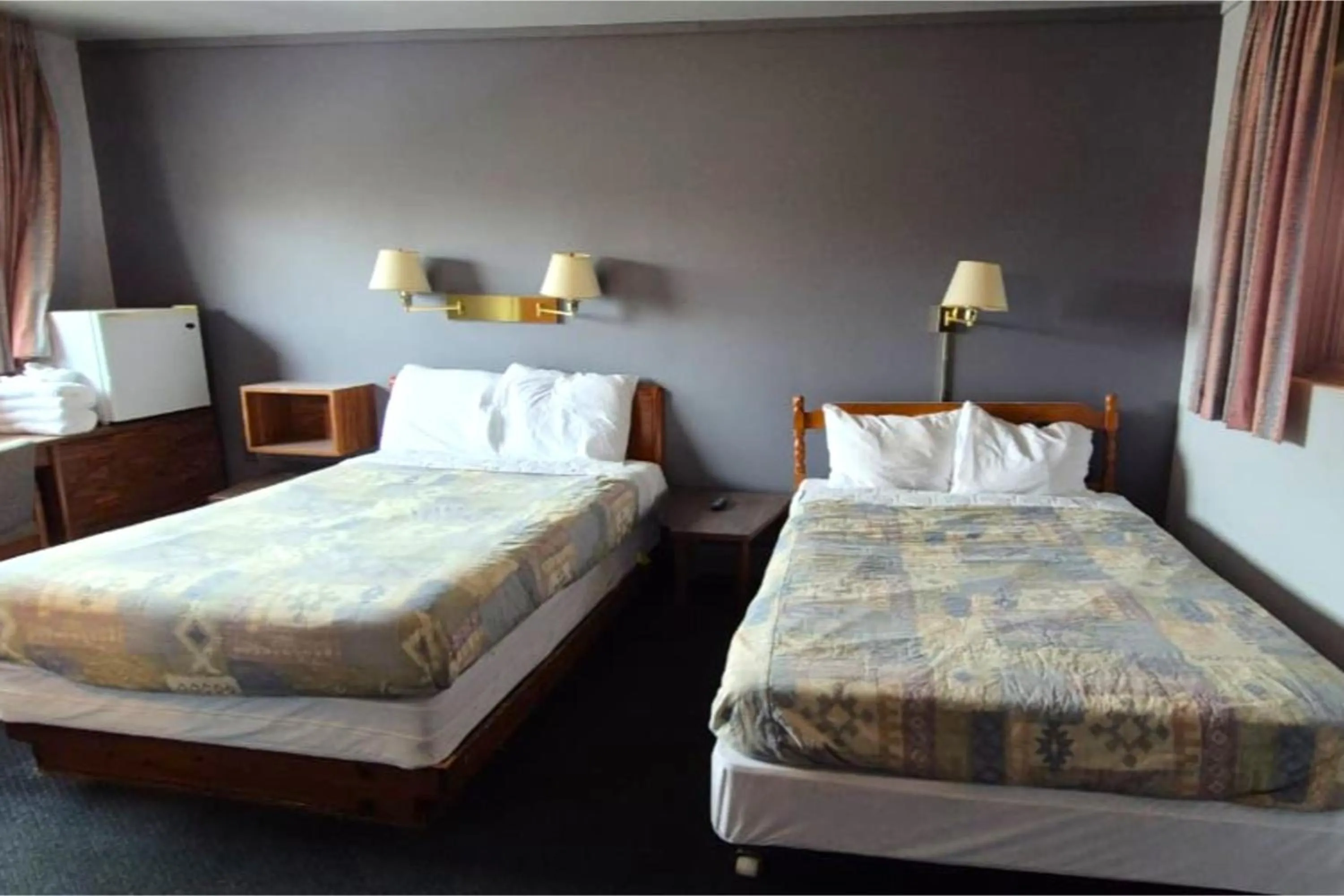 Bedroom, Bed in Capital O Swan Inn Comstock Park