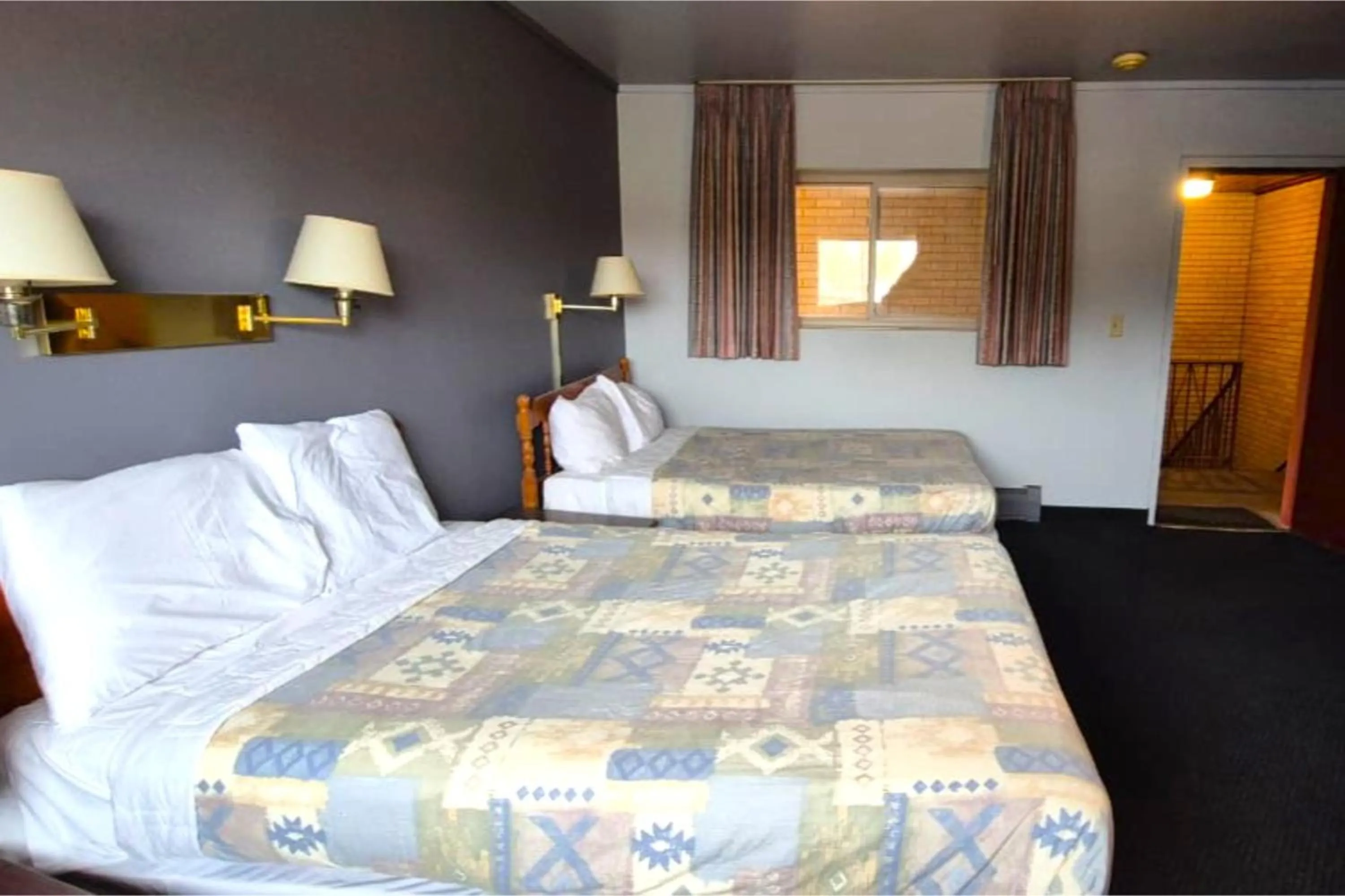 Bedroom, Bed in Capital O Swan Inn Comstock Park