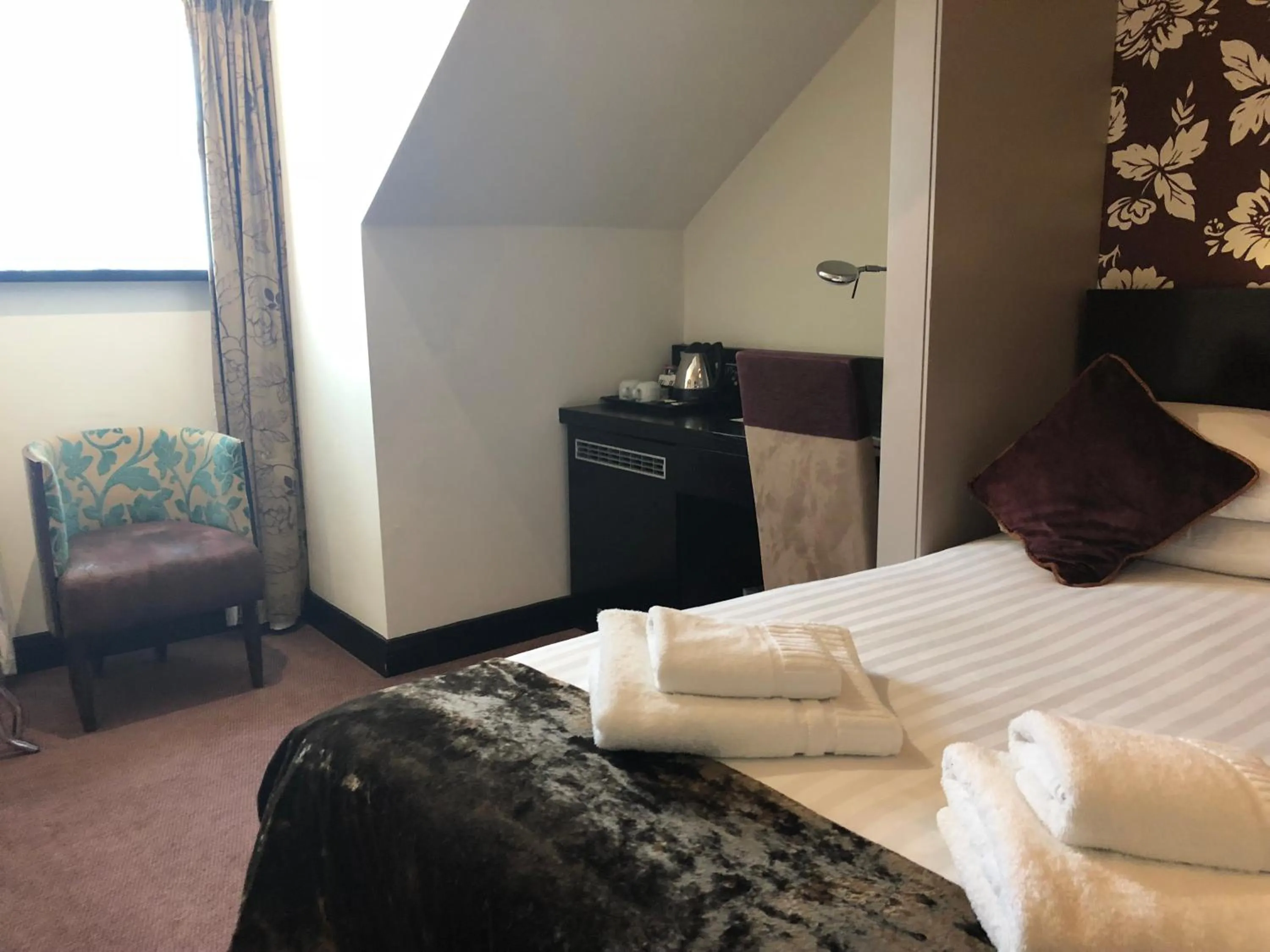 Bed in The BlueBell Hotel