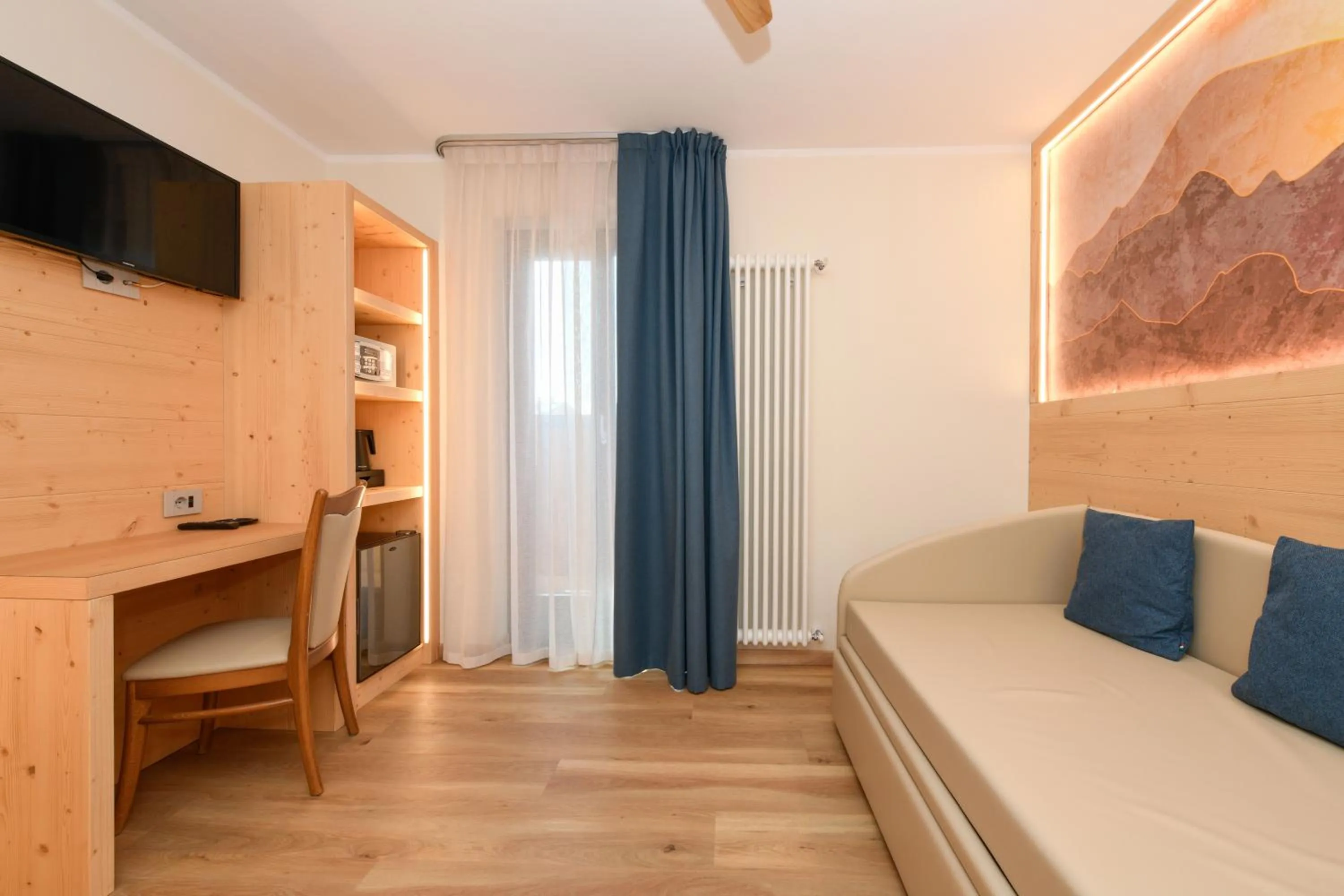 Living room, Bed in Hotel Denny