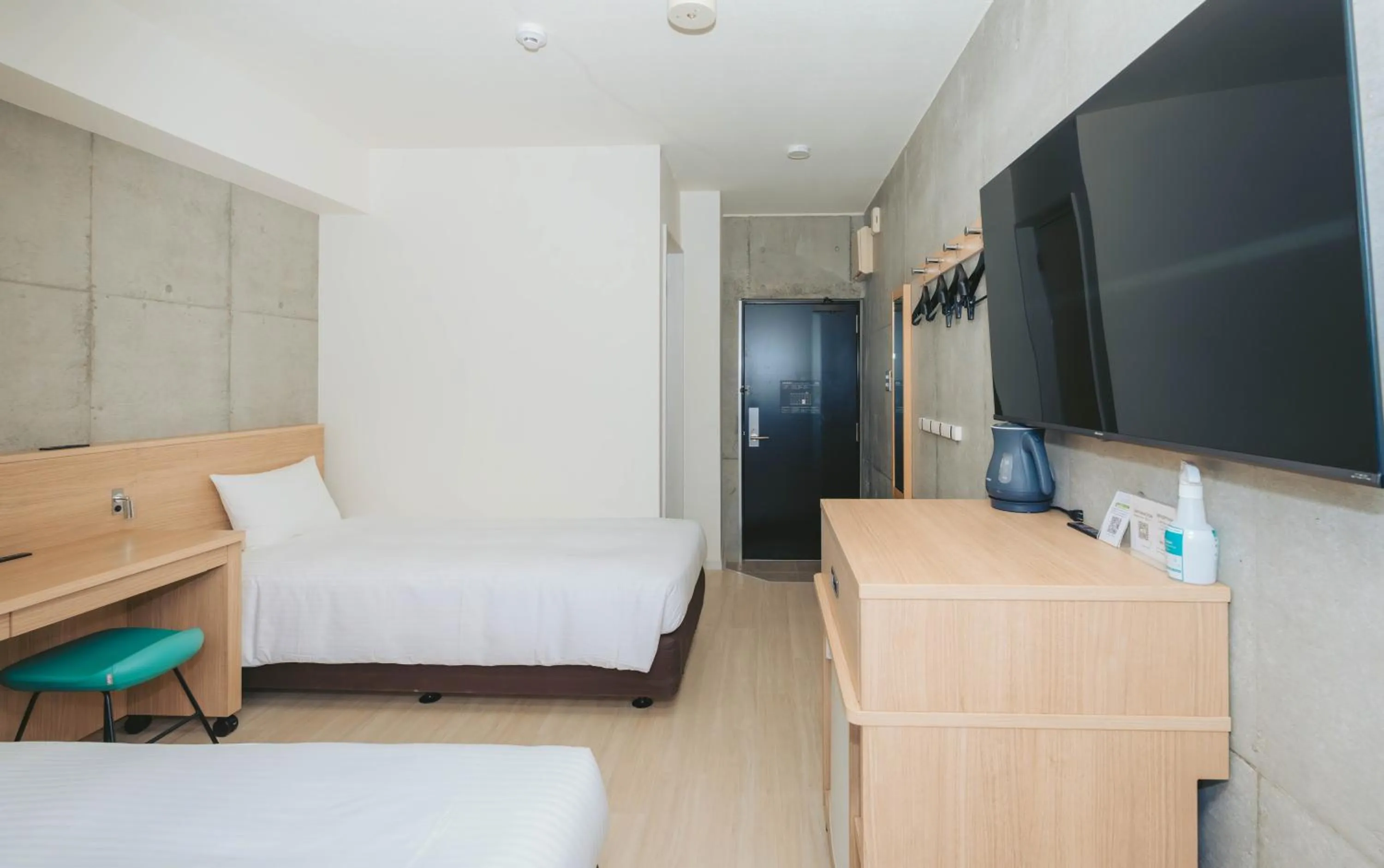 Photo of the whole room, Bed in The BREAKFAST HOTEL MARCHE Ishigaki Island