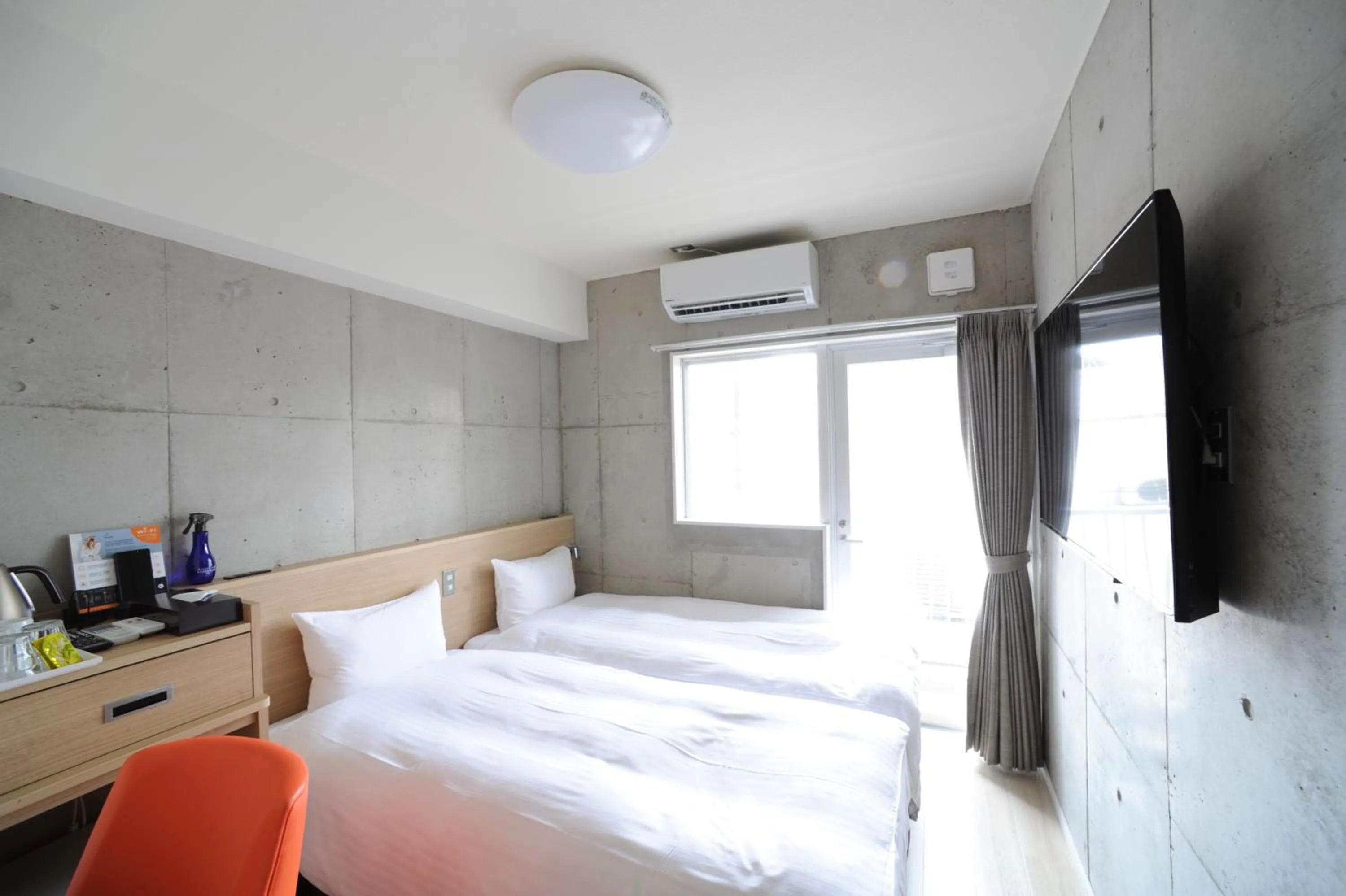 Photo of the whole room, Bed in The BREAKFAST HOTEL MARCHE Ishigaki Island