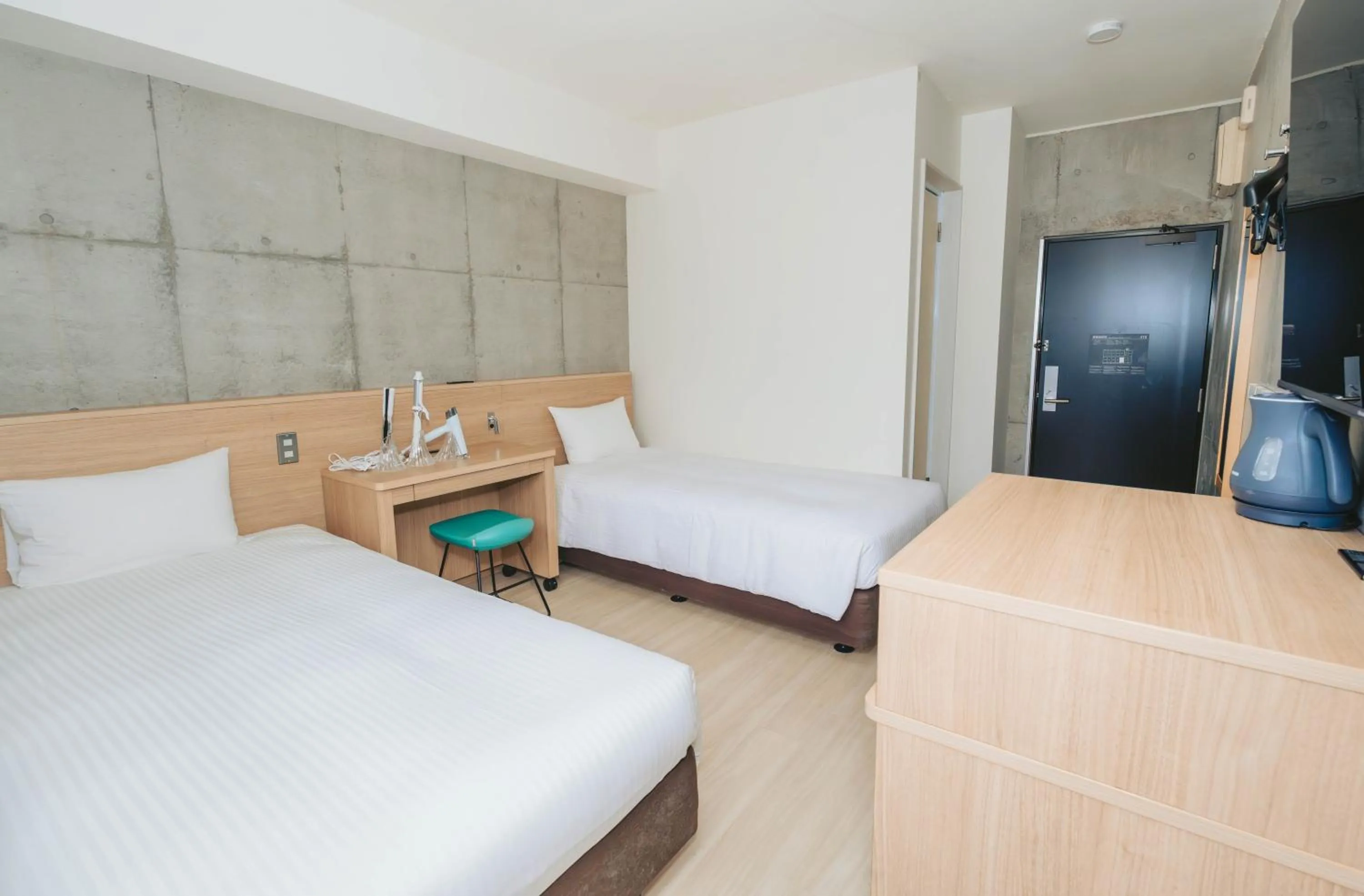 Photo of the whole room, Bed in The BREAKFAST HOTEL MARCHE Ishigaki Island