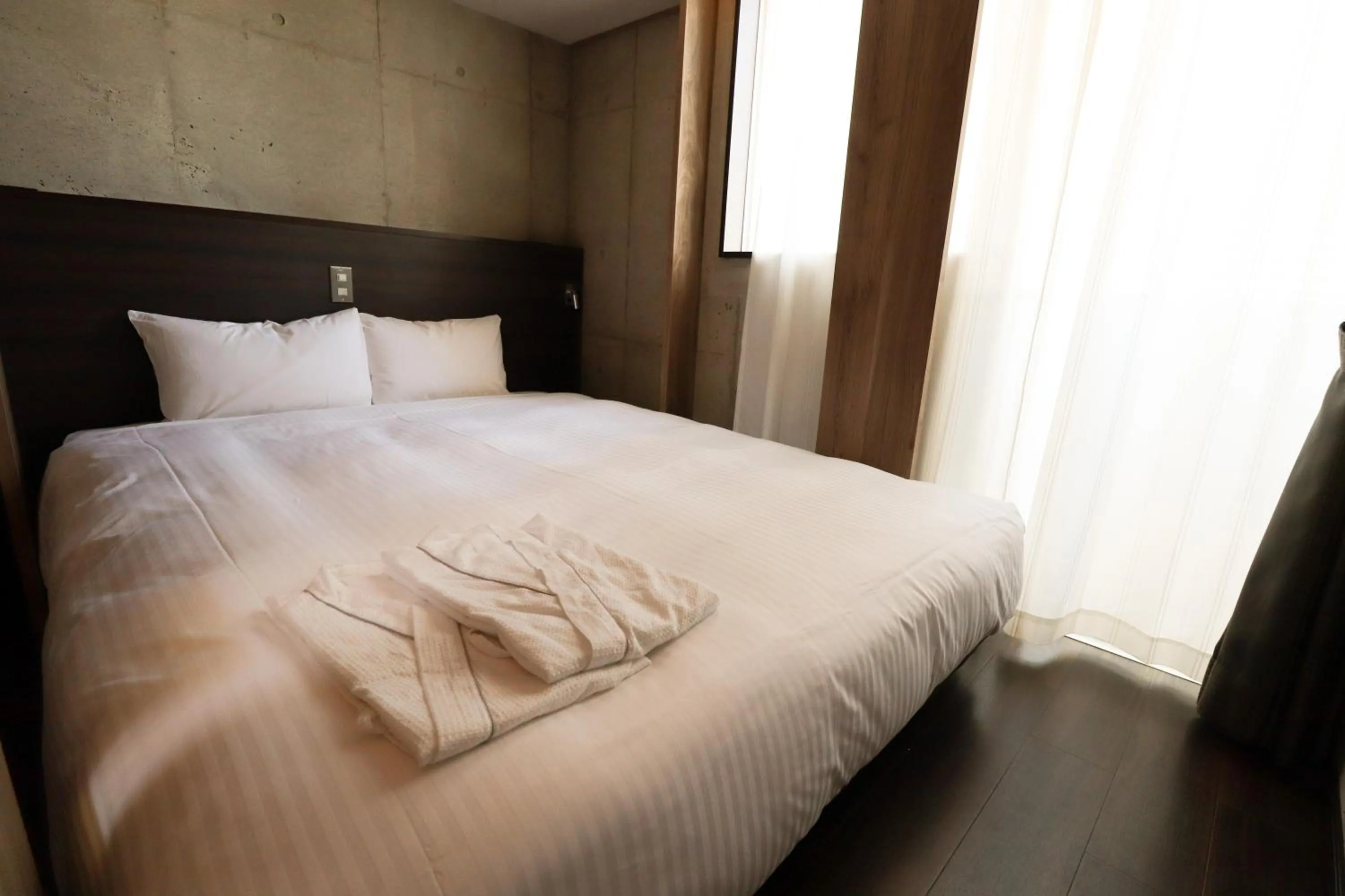 Photo of the whole room, Bed in The BREAKFAST HOTEL MARCHE Ishigaki Island