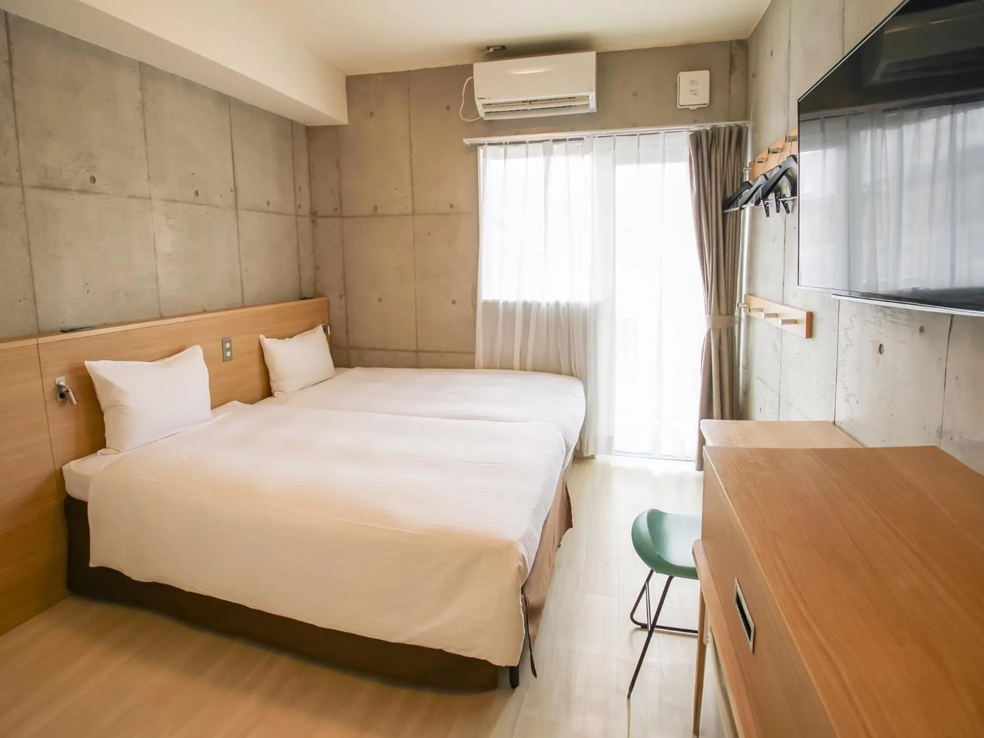 Photo of the whole room, Bed in The BREAKFAST HOTEL MARCHE Ishigaki Island