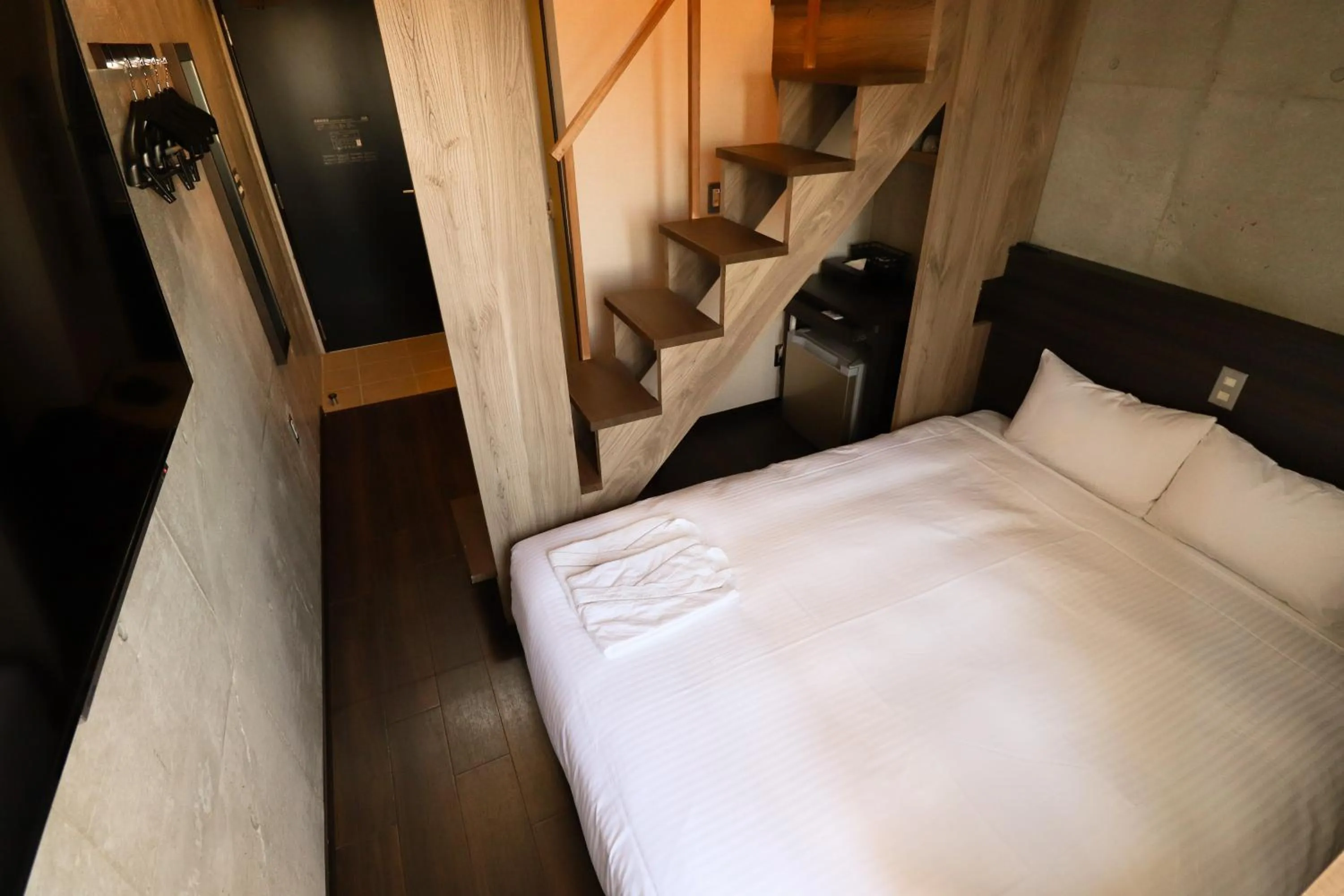 Photo of the whole room, Bed in The BREAKFAST HOTEL MARCHE Ishigaki Island