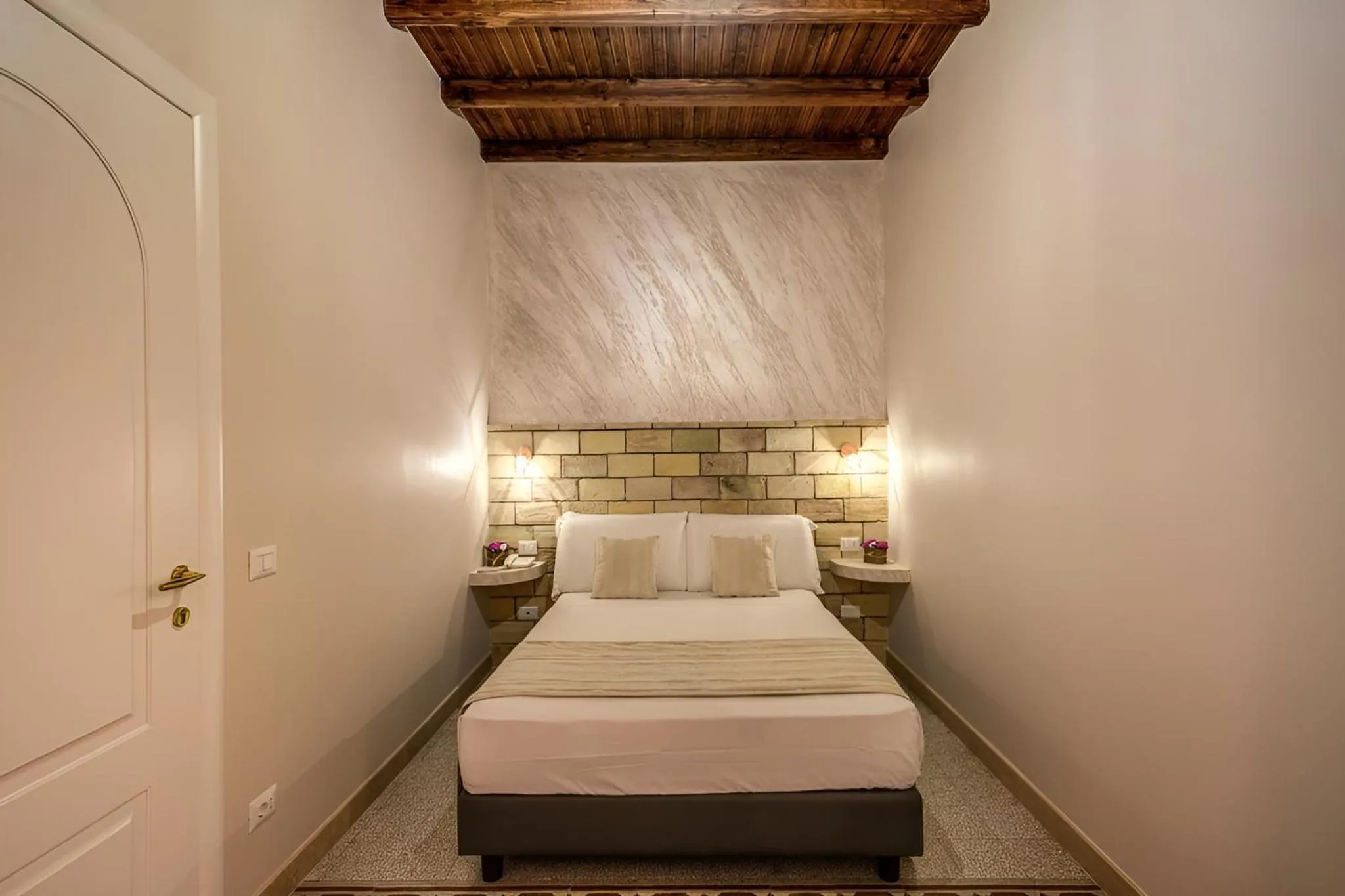 Bed in Colosseo Accomodation Room Guest House