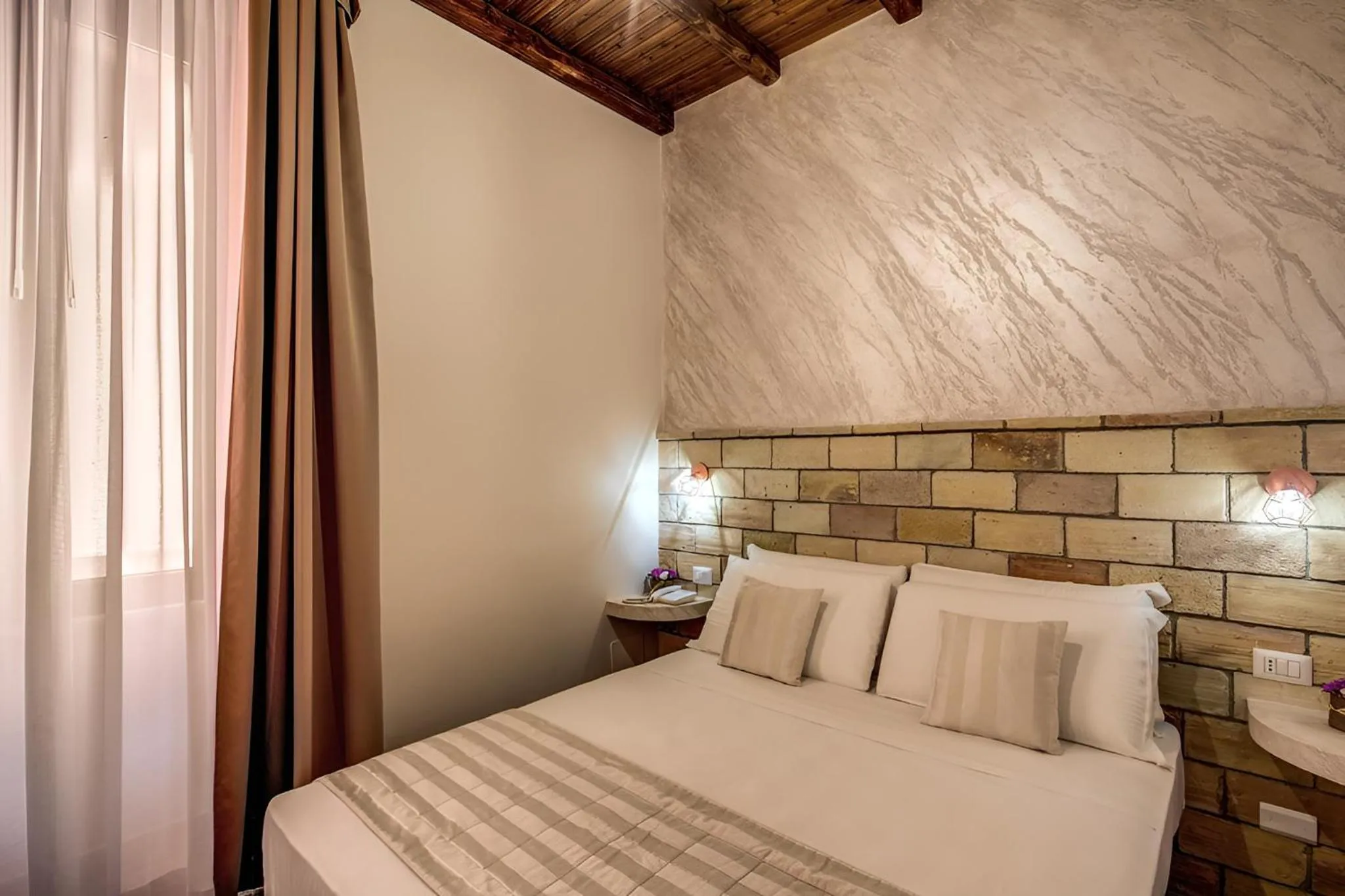 Bed in Colosseo Accomodation Room Guest House