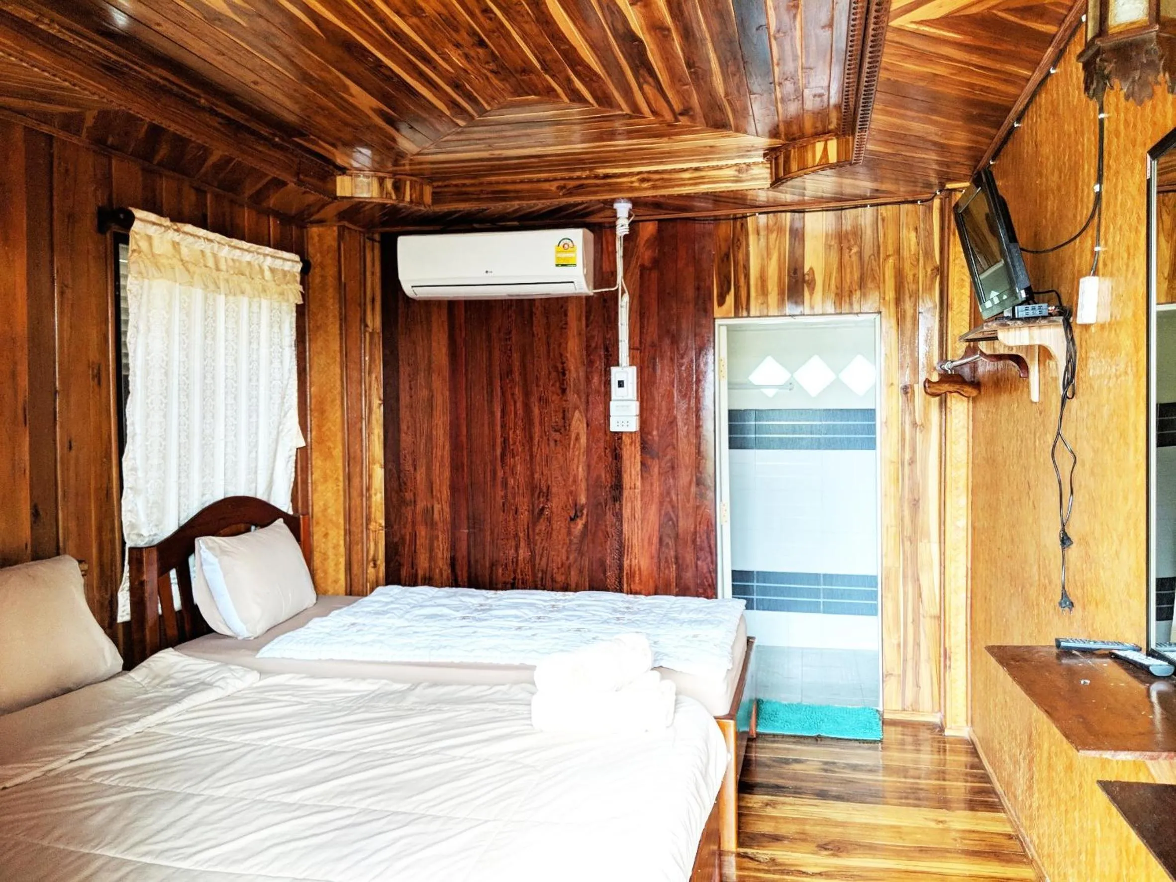 Bed in Bansuanphuhong Resort