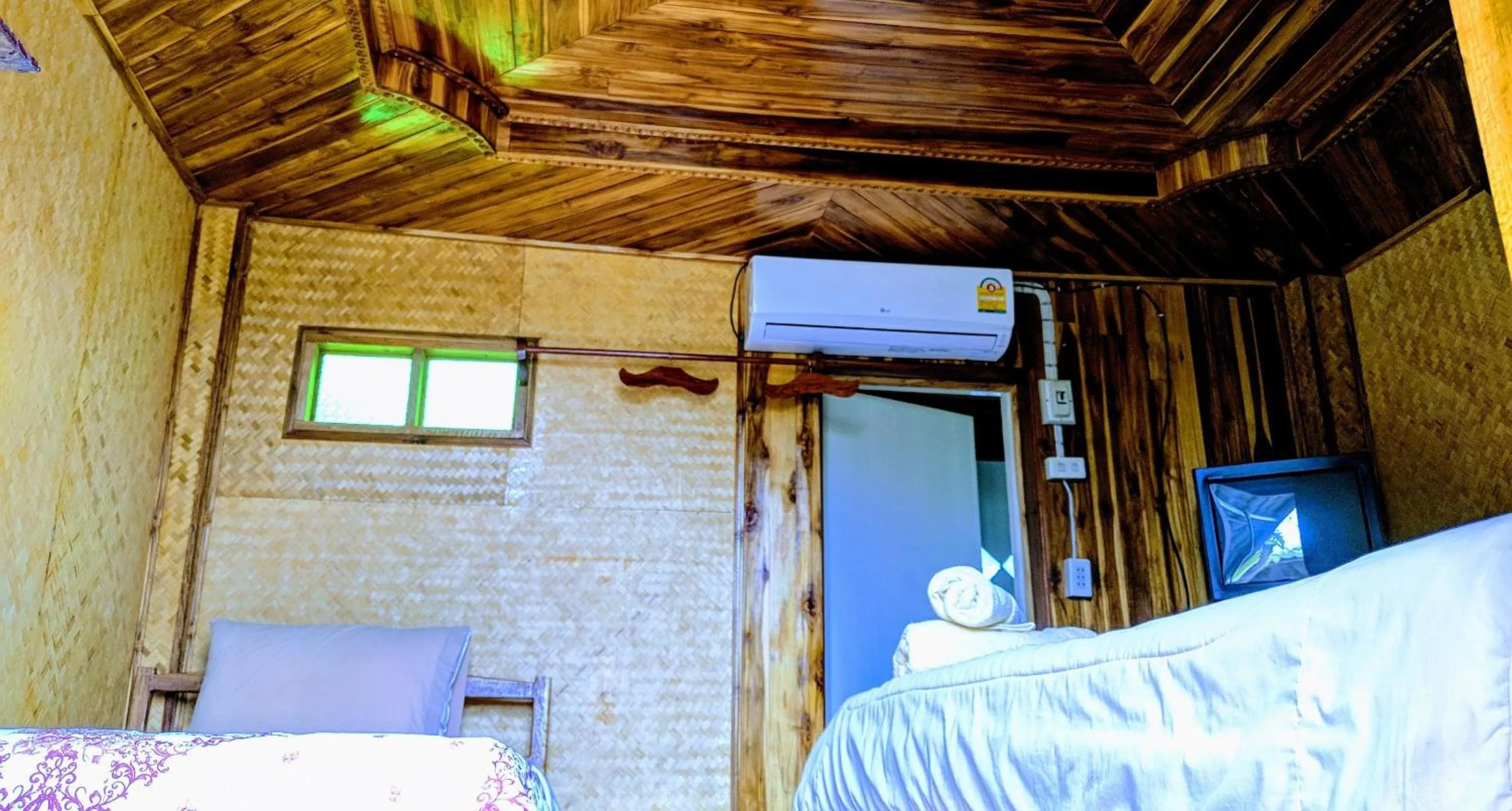 Bed in Bansuanphuhong Resort