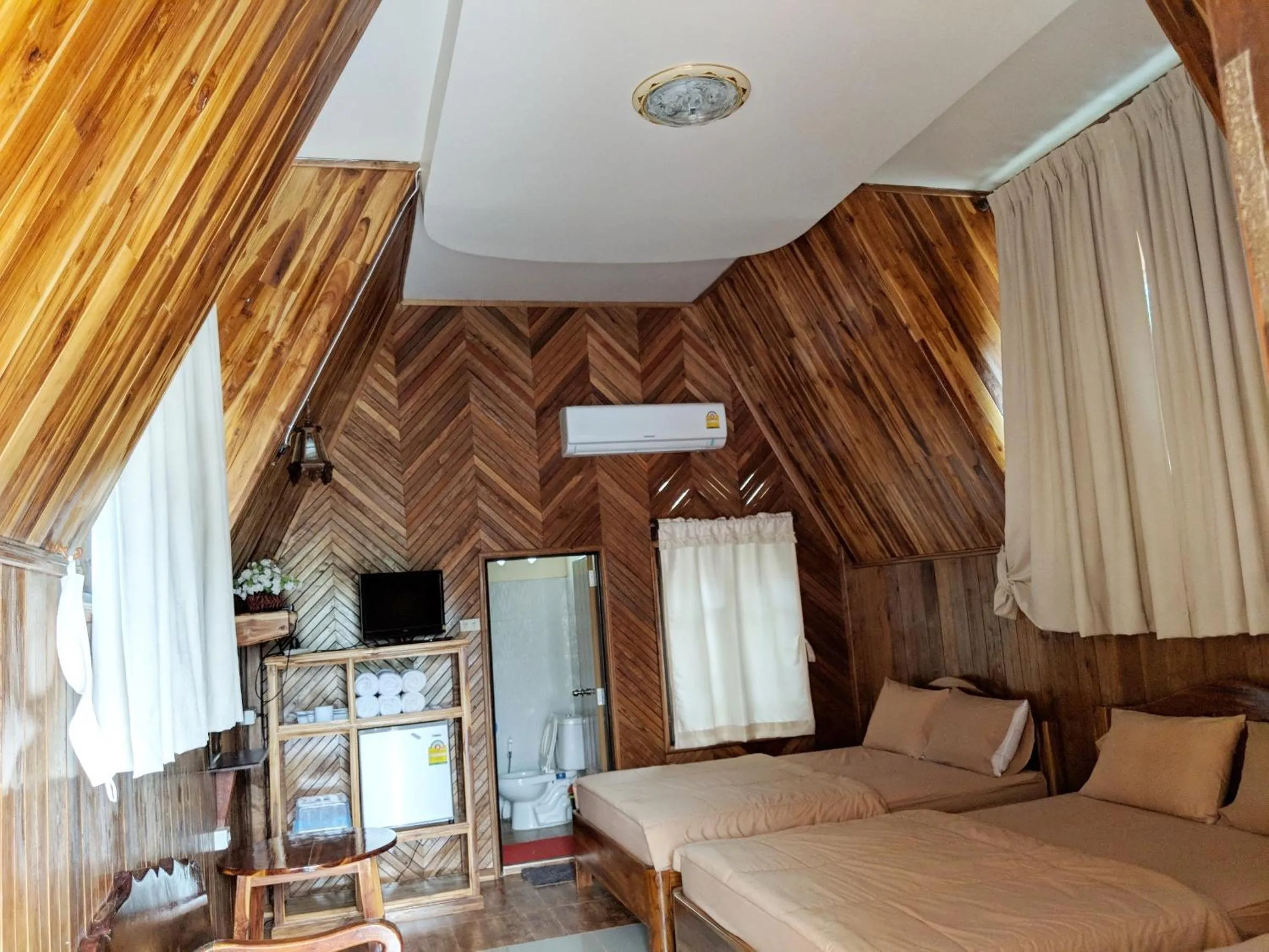 Bed in Bansuanphuhong Resort