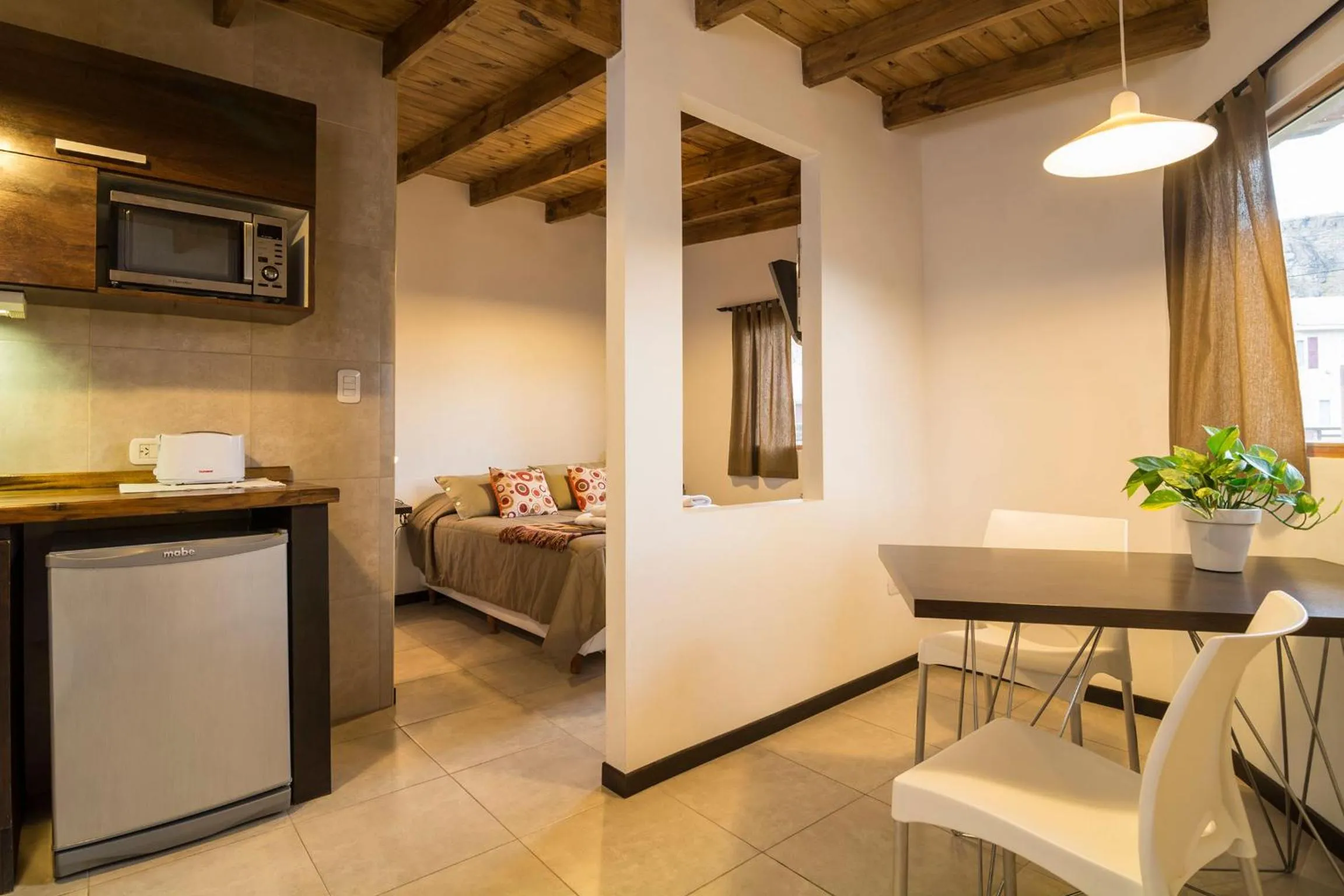 Kitchen or kitchenette, Bed in Posada y Cabañas El Barranco