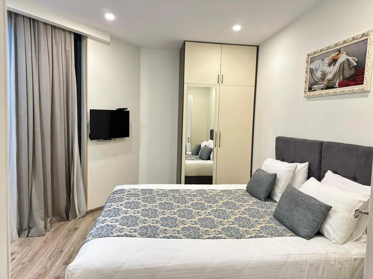 Bed in Bellevue Residence Suites