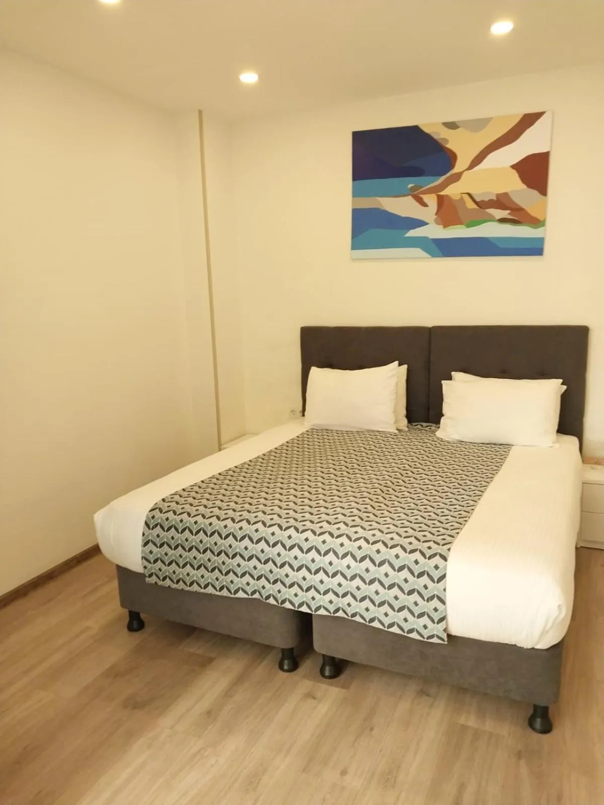 Bed in Bellevue Residence Suites