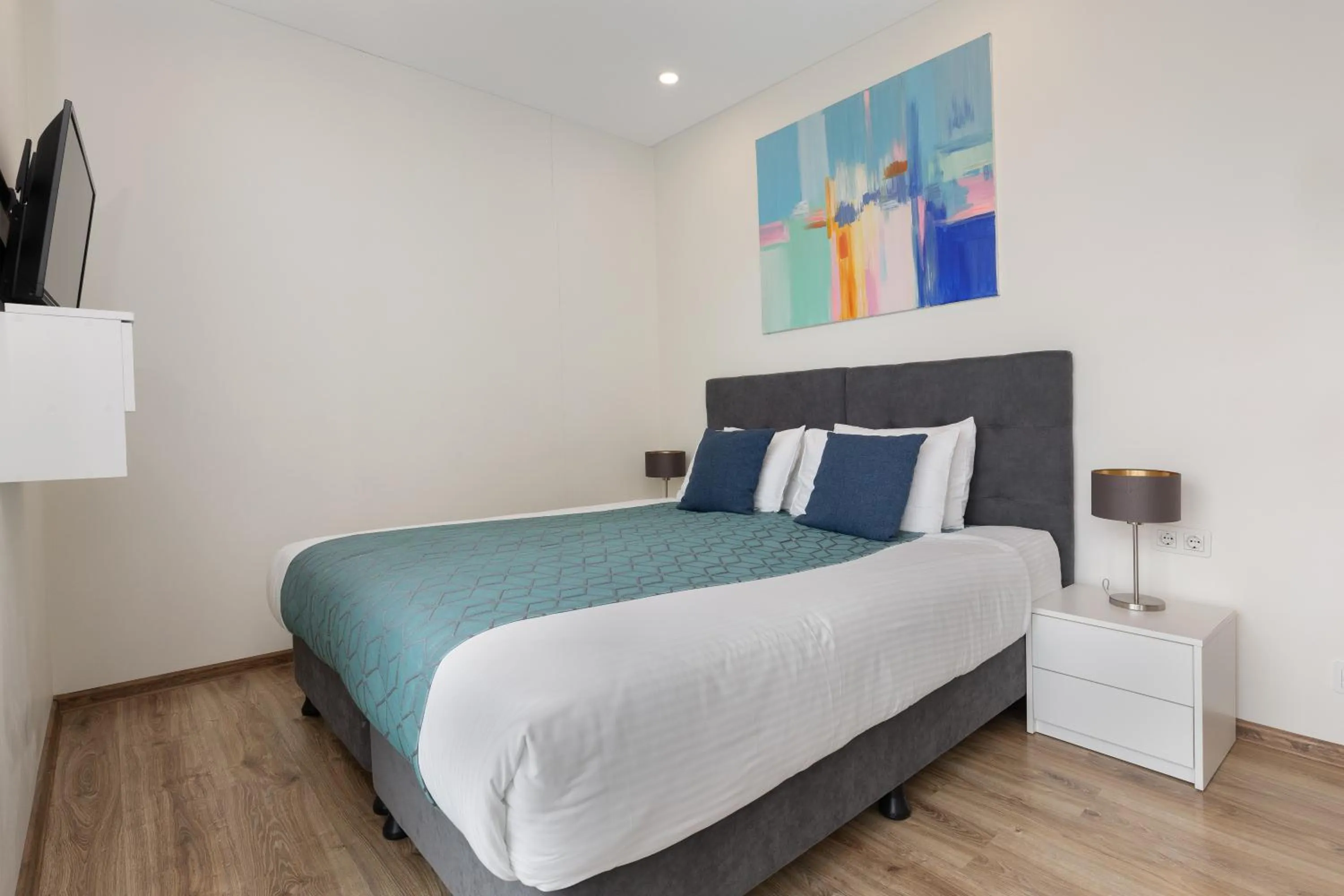 Bed in Bellevue Residence Suites