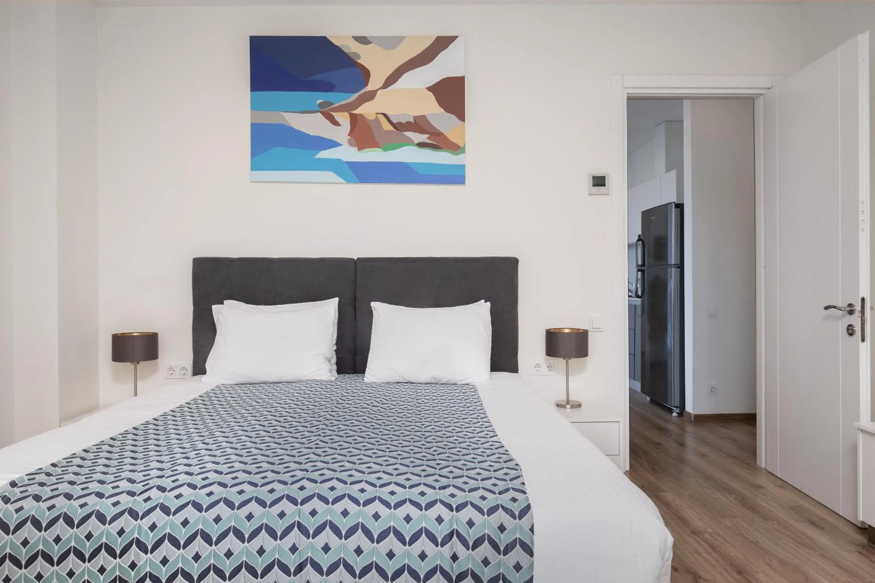 Bed in Bellevue Residence Suites