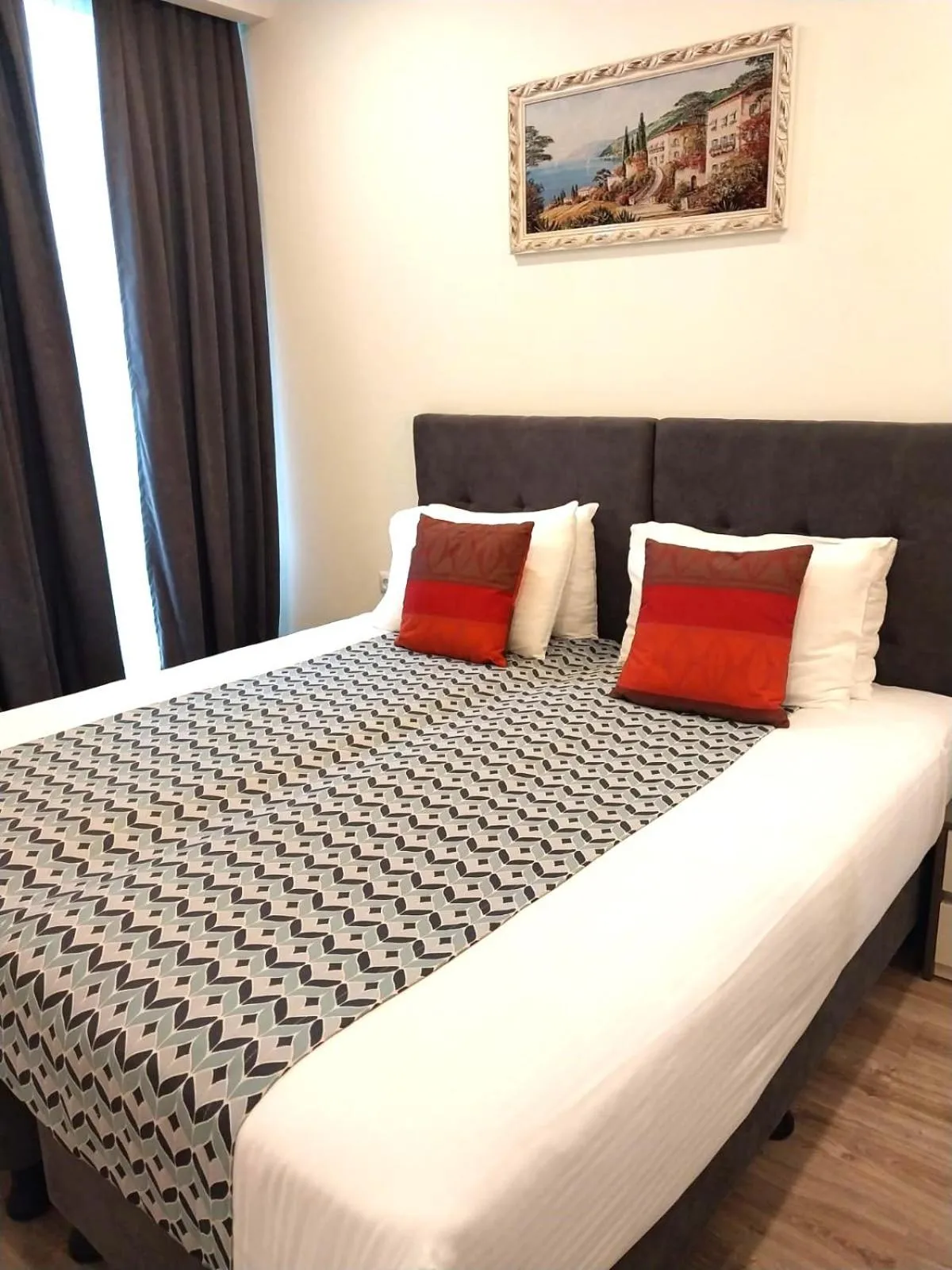 Bed in Bellevue Residence Suites