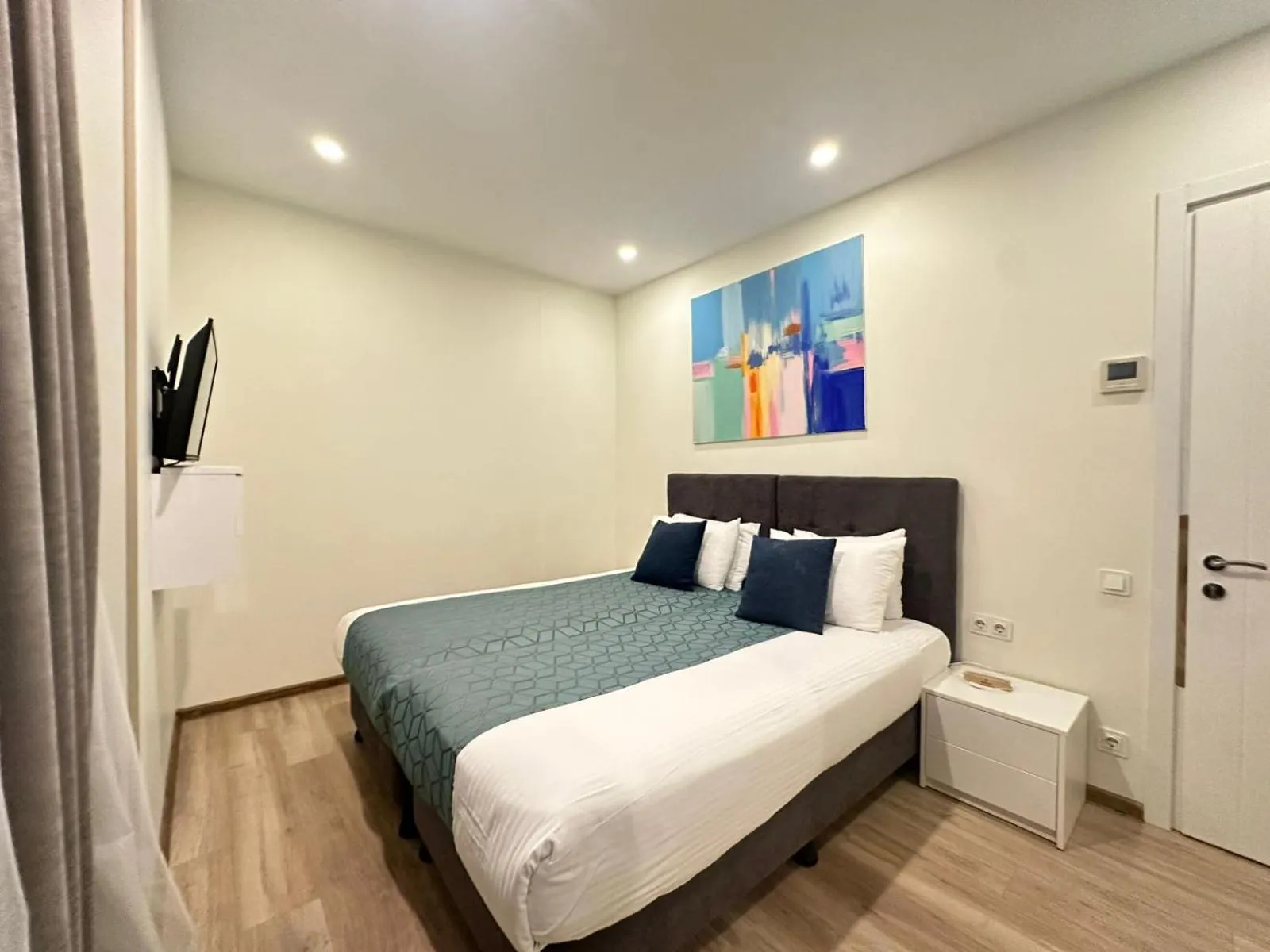 Bed in Bellevue Residence Suites