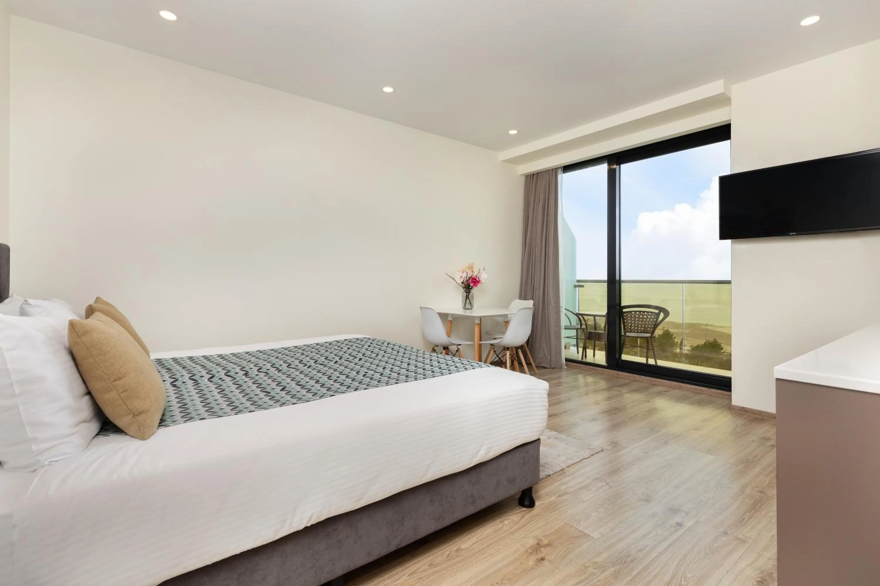 Bed in Bellevue Residence Suites