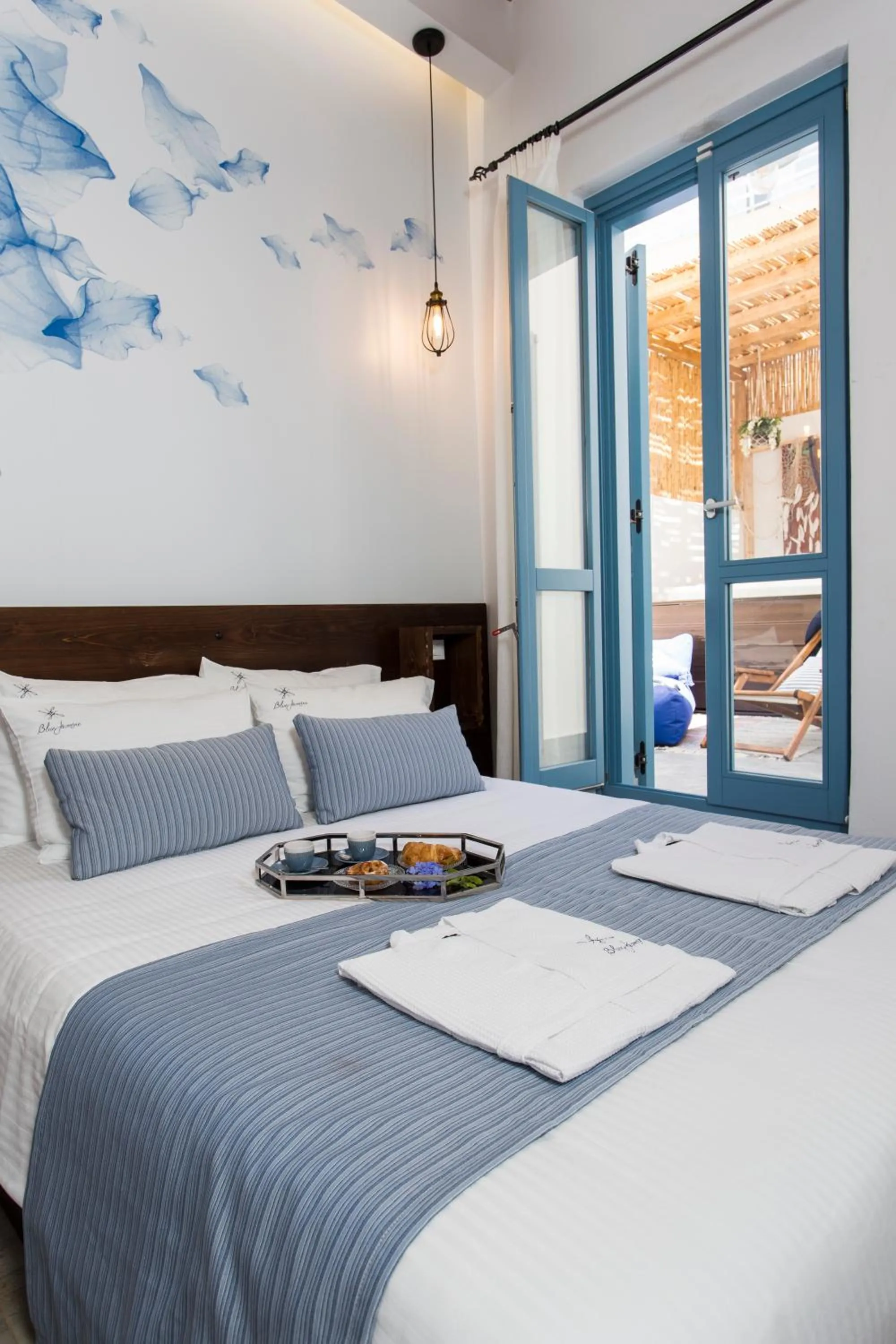 Bed in Blue Jasmine Suites