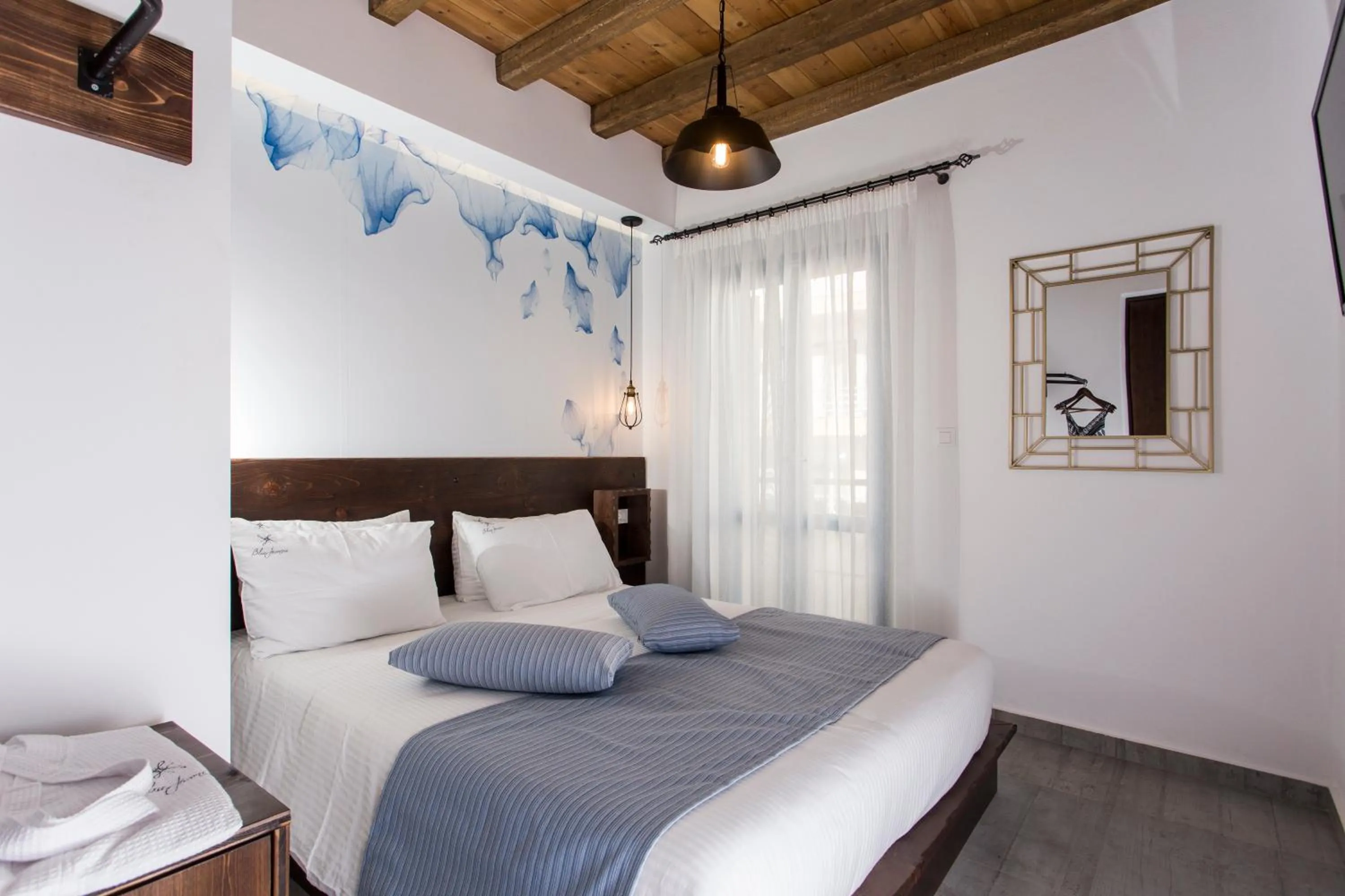 Bedroom in Blue Jasmine Suites