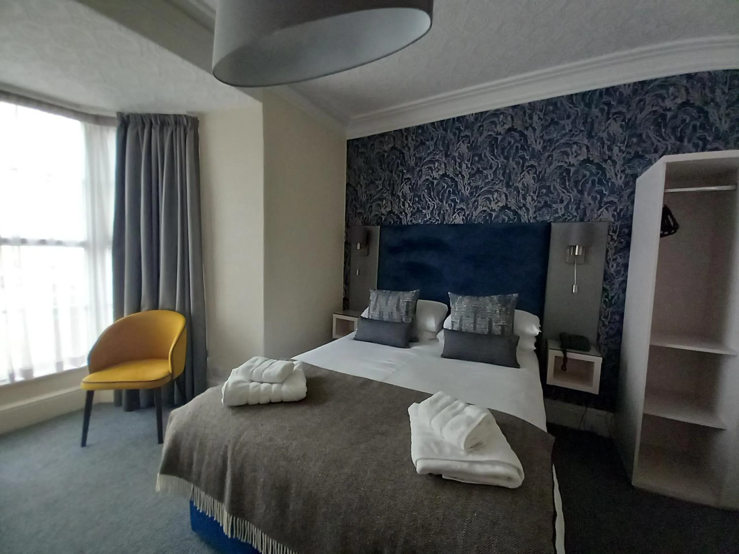 Bed in Royal Sportsman Hotel