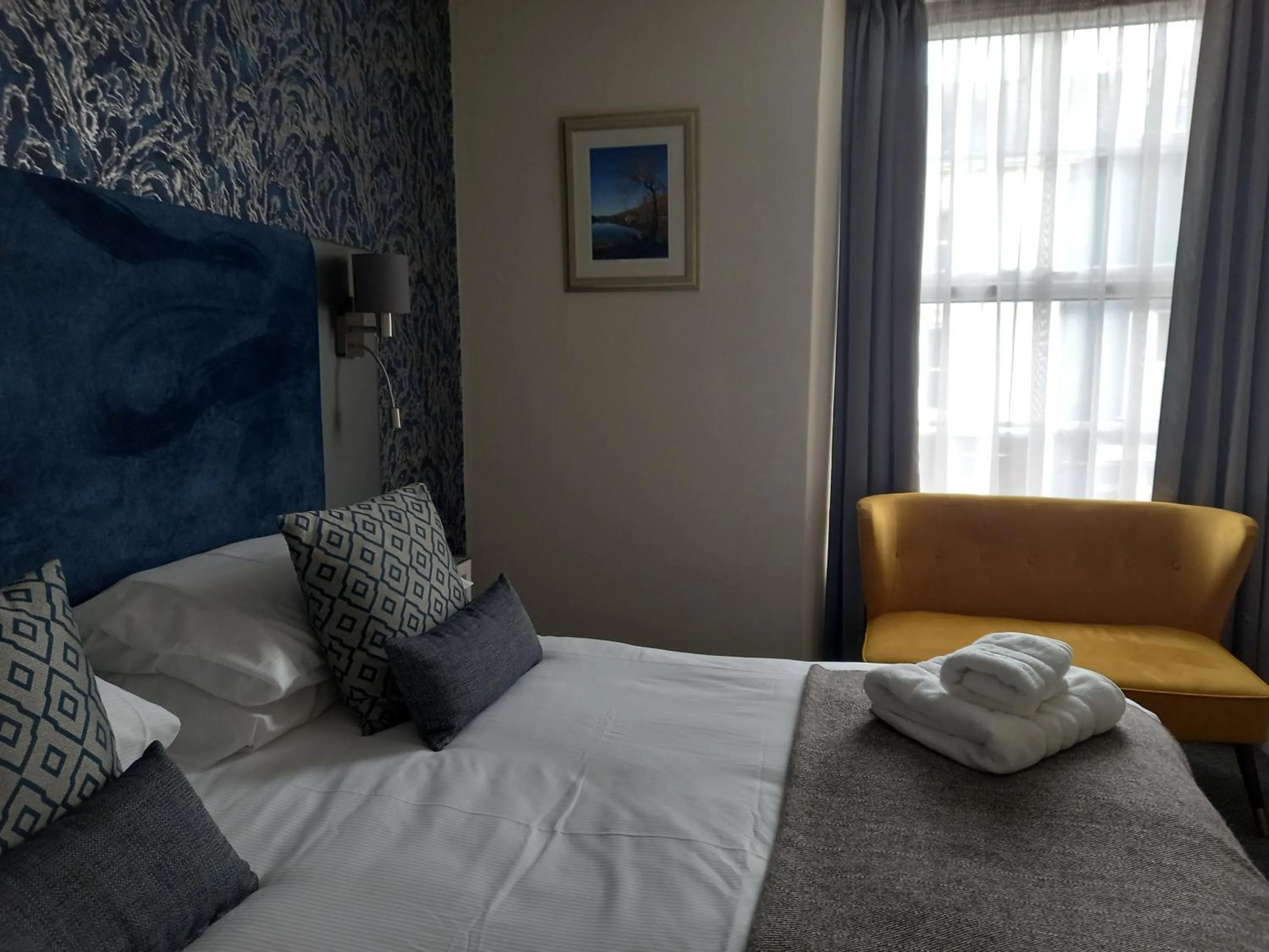 Bed in Royal Sportsman Hotel