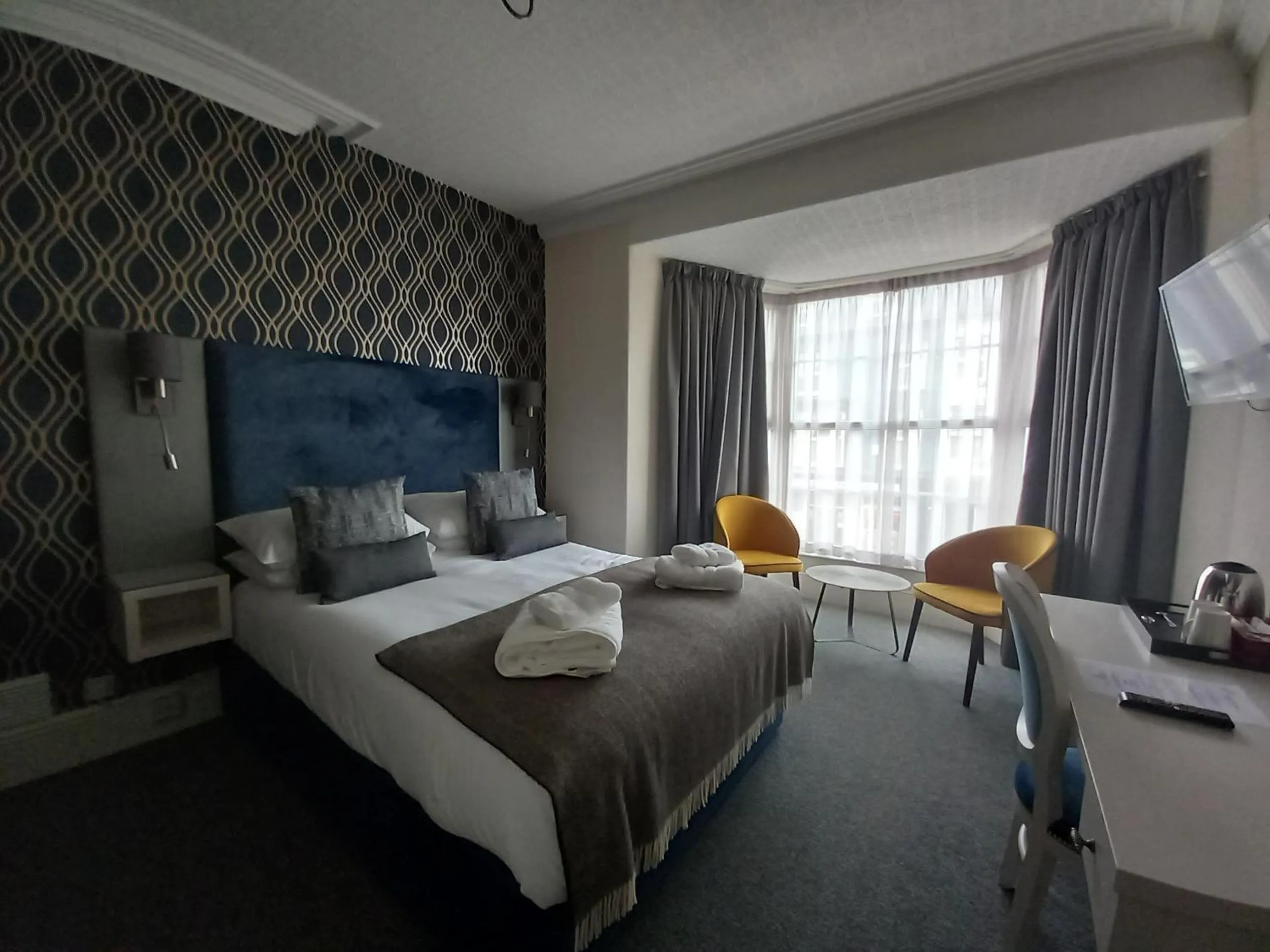 Bed in Royal Sportsman Hotel