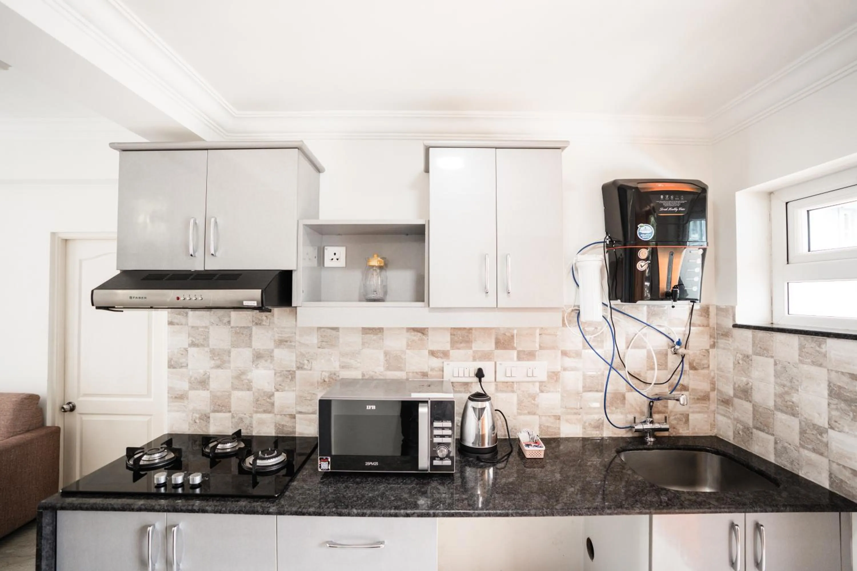 Kitchen or kitchenette in Bellagio Rezidencia 1 BHK Service Apartments