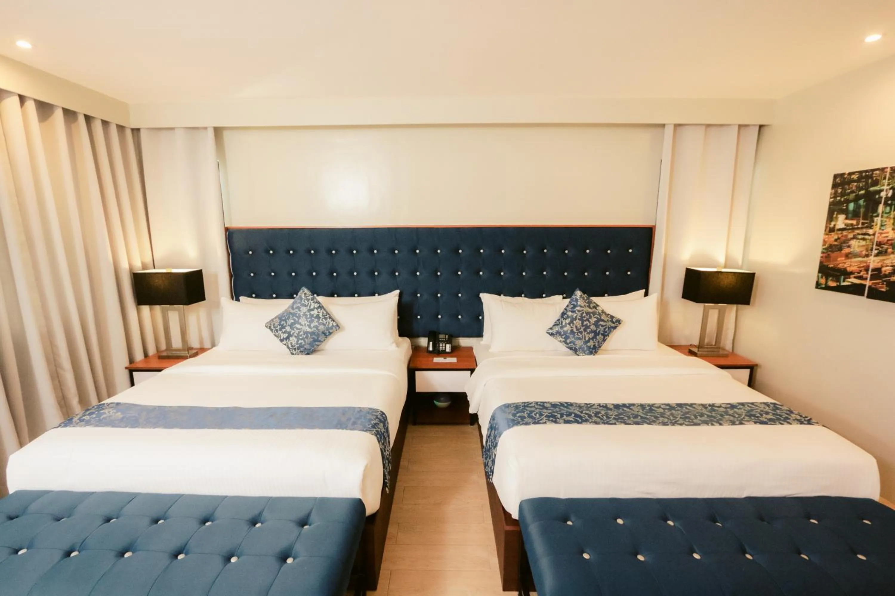 Bed in The Madeline Boutique Hotel & Suites