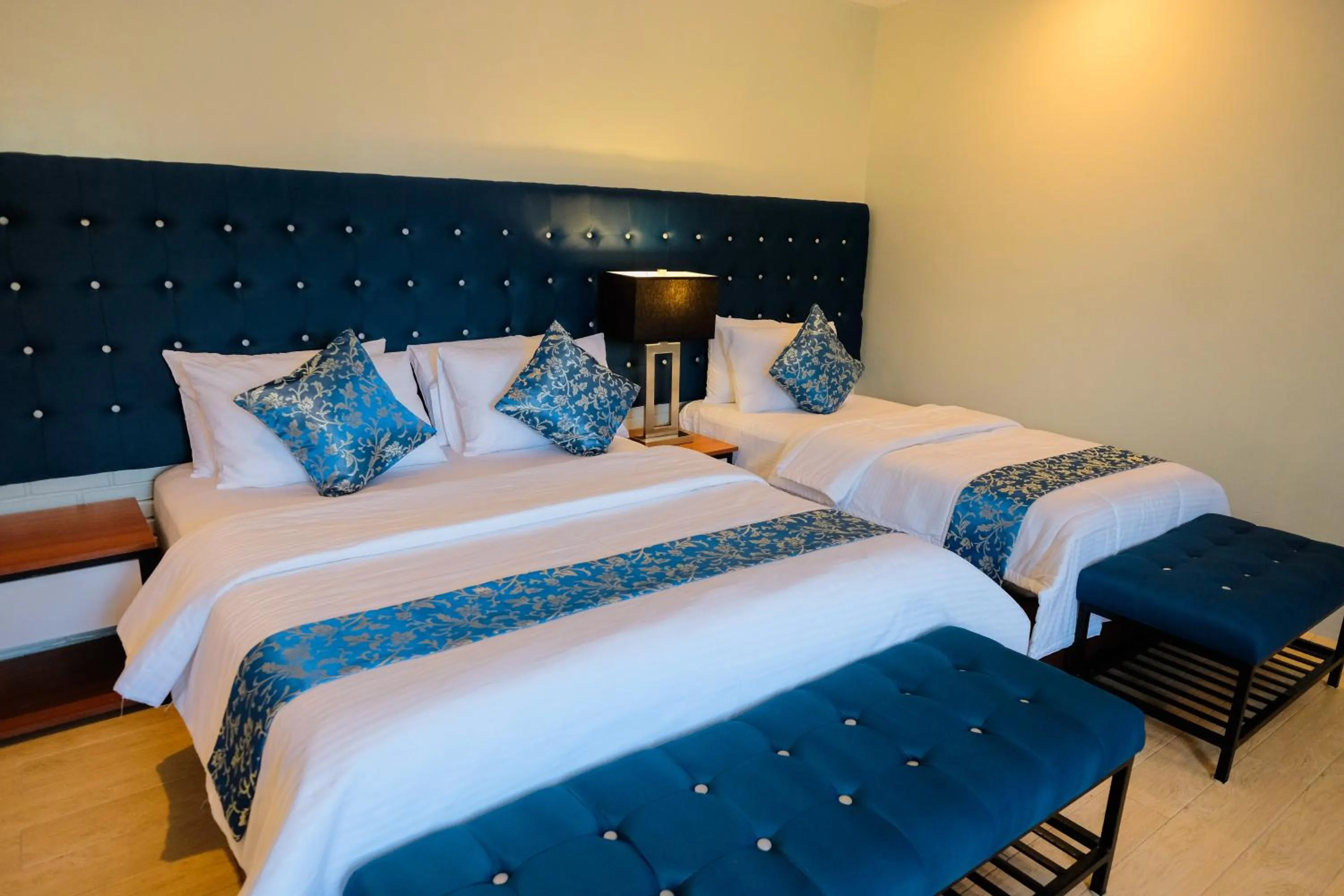 Bed in The Madeline Boutique Hotel & Suites