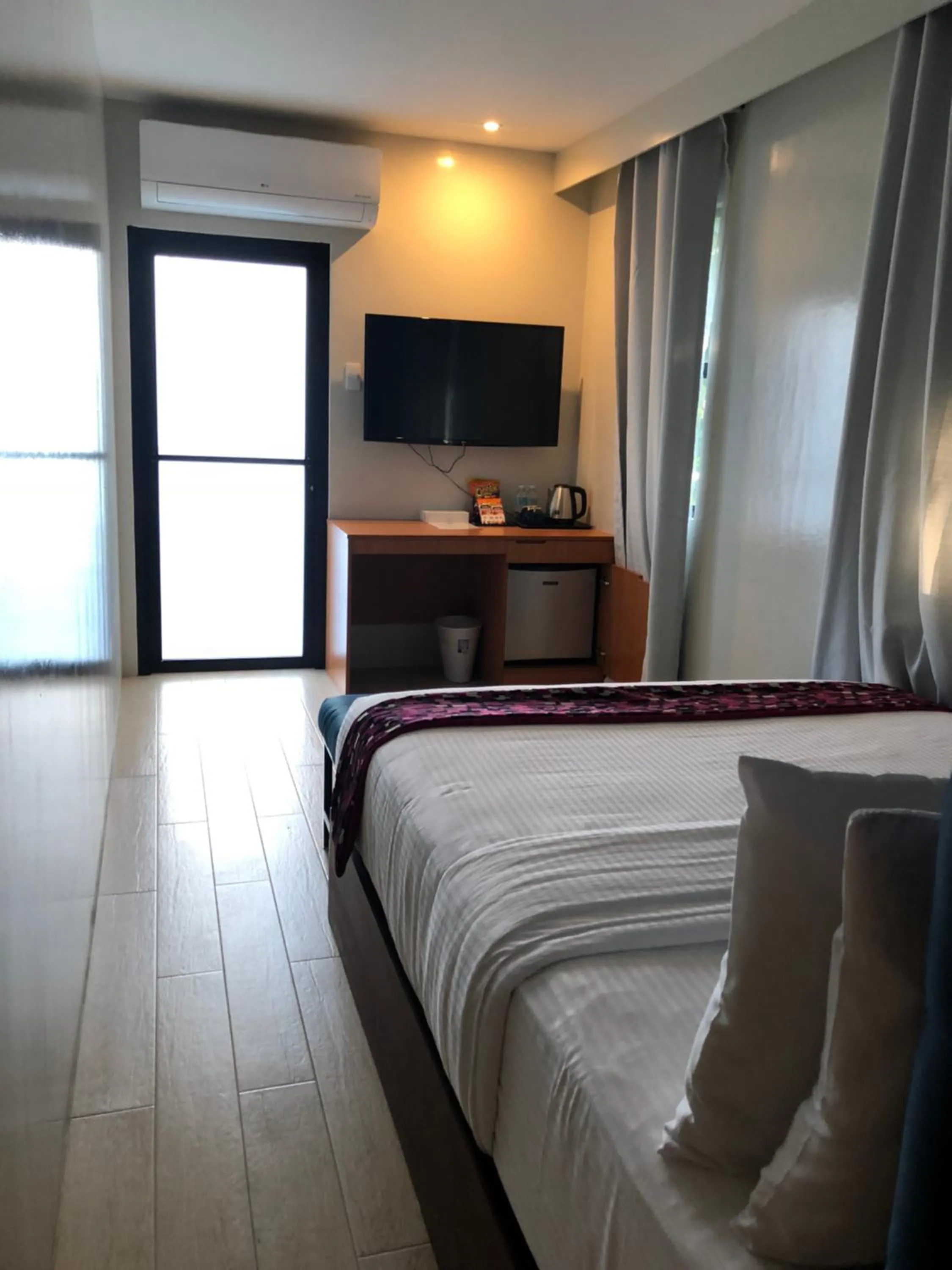 Bed in The Madeline Boutique Hotel & Suites