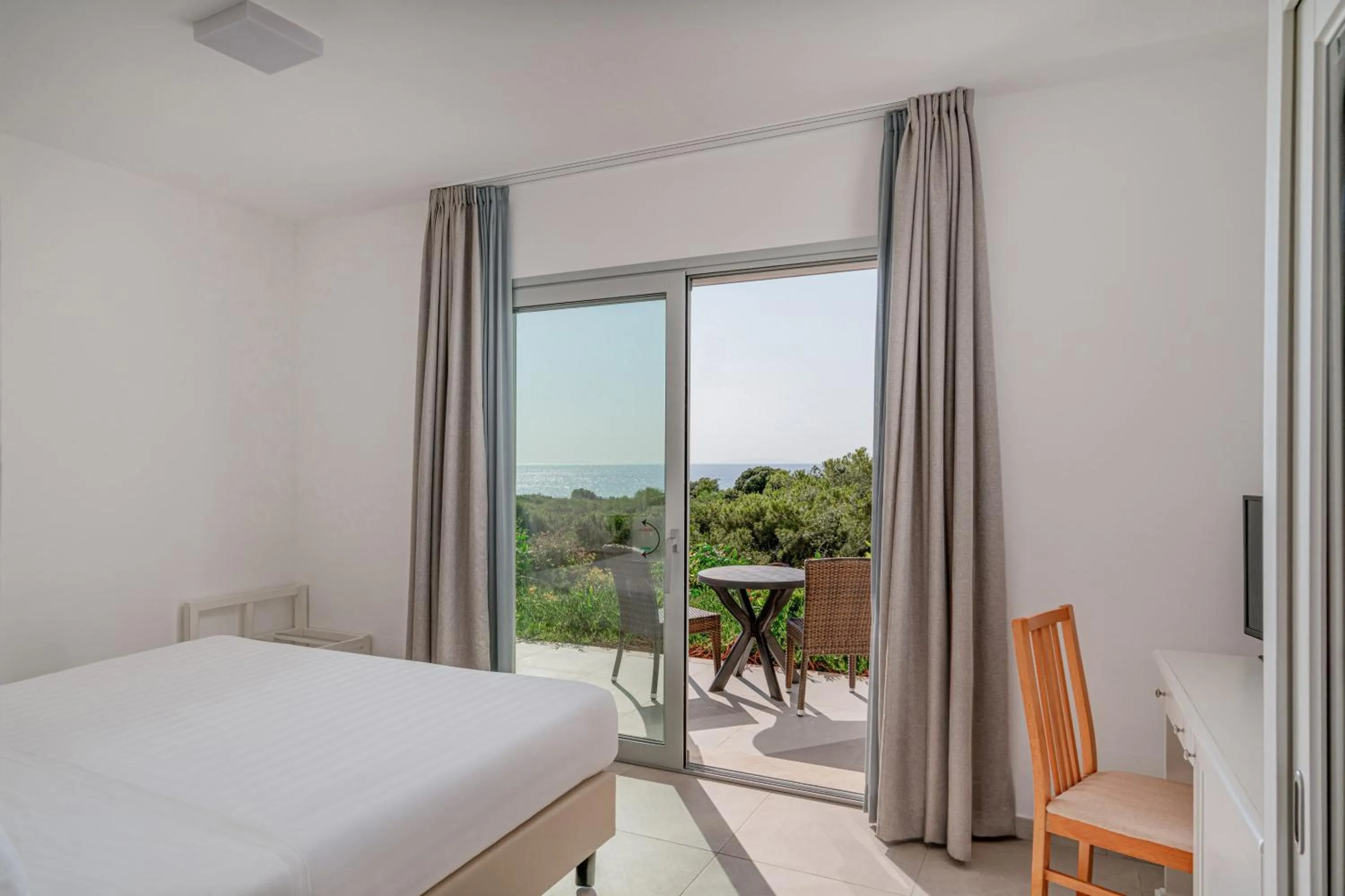 Bed in Bellevue Sardinia Resort Affiliated by Meliá