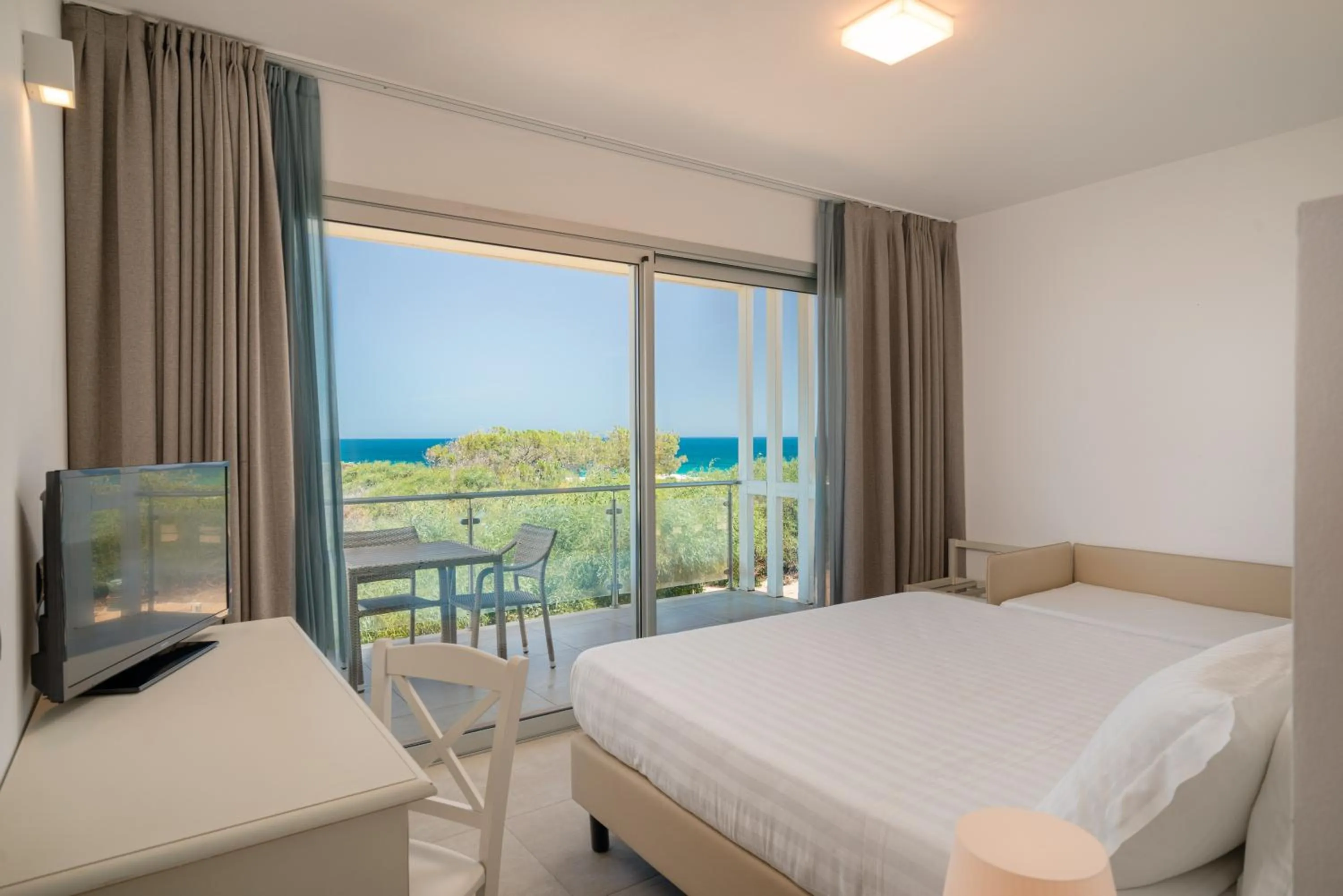 Bed in Bellevue Sardinia Resort Affiliated by Meliá