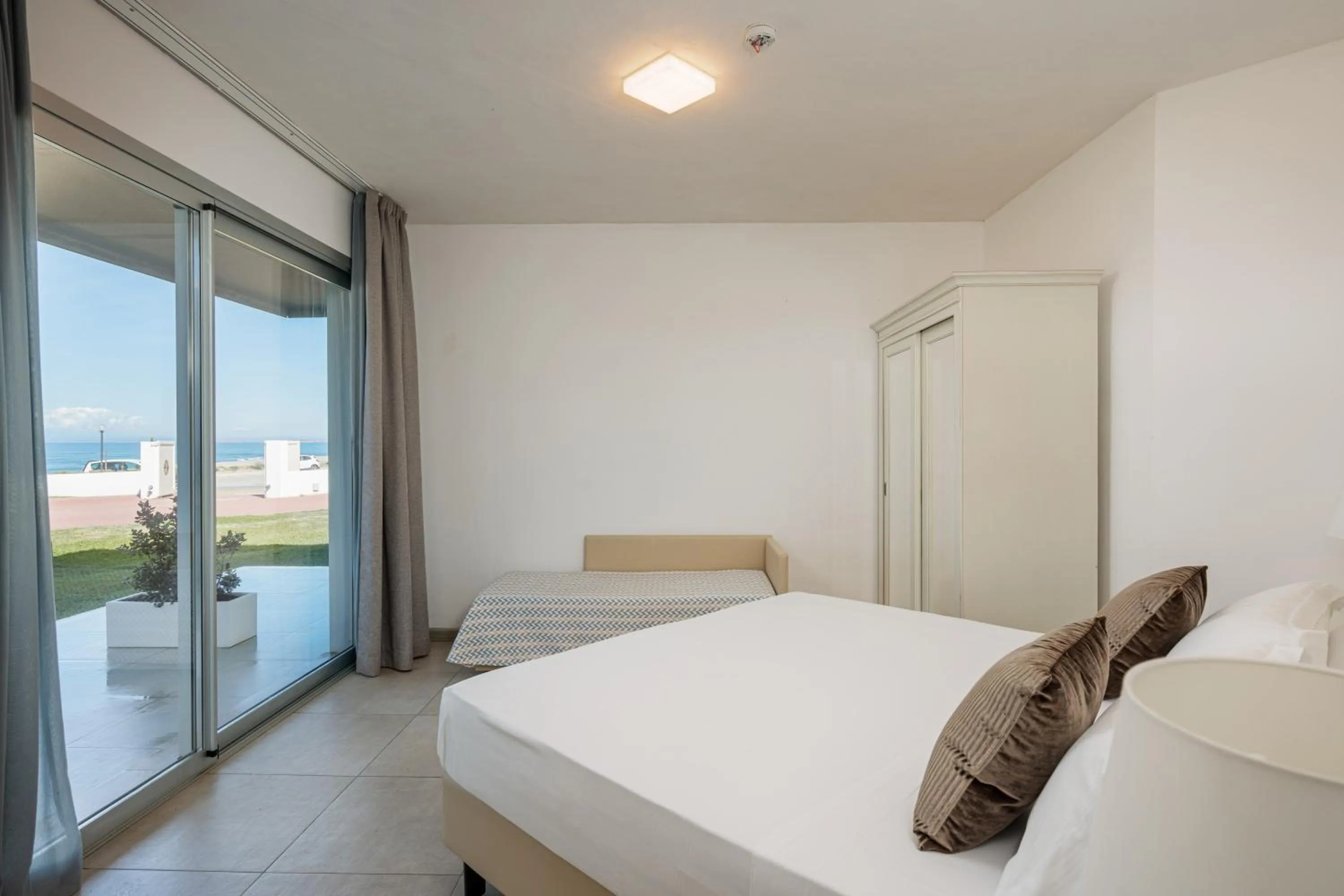 Bed in Bellevue Sardinia Resort Affiliated by Meliá