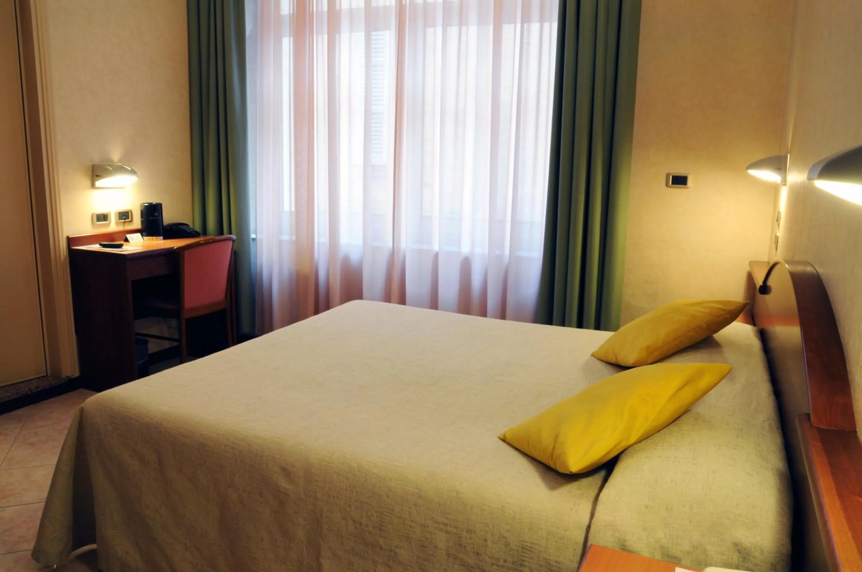 Photo of the whole room, Bed in Hotel Button