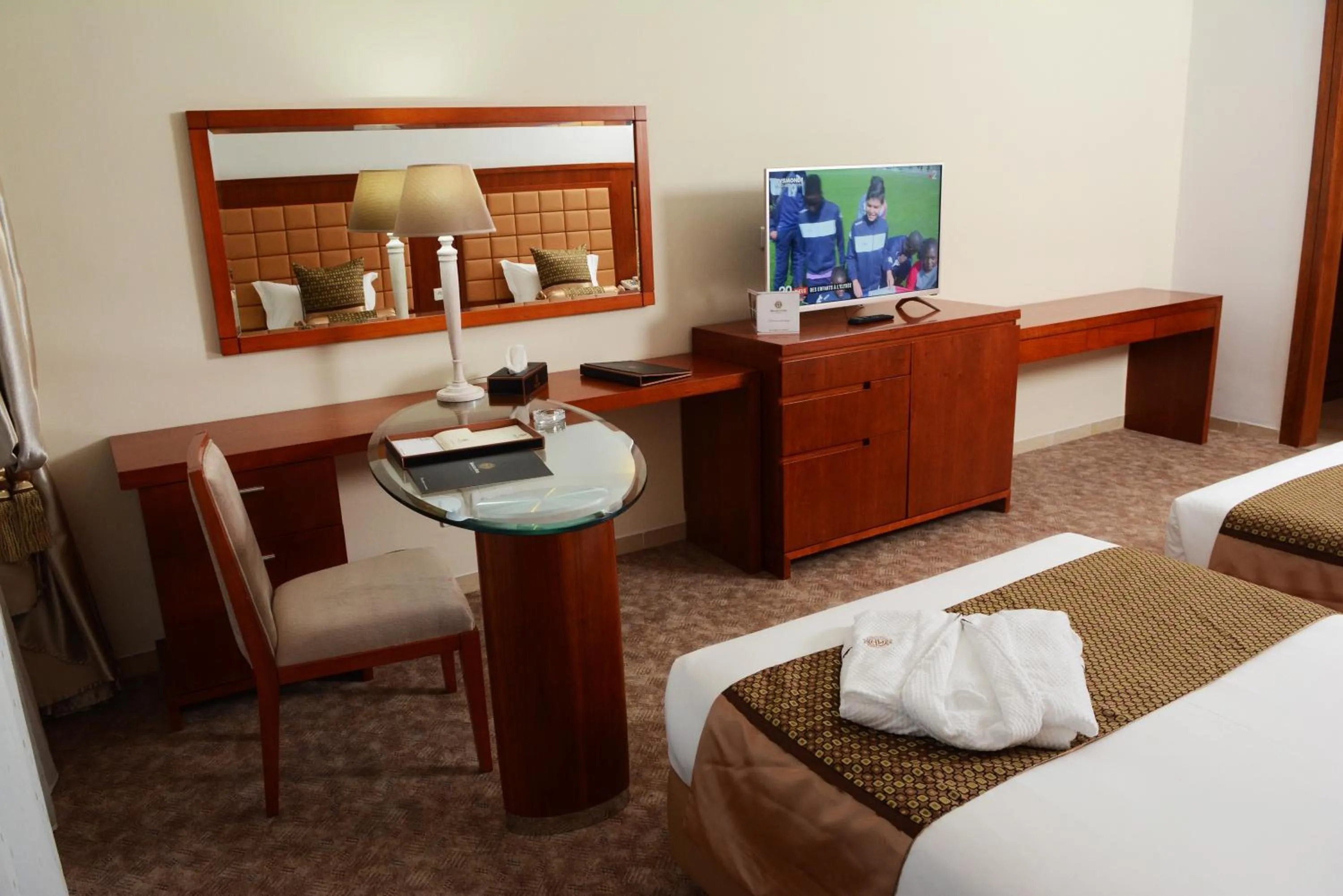 Seating area, Bed in Marigold Hotel