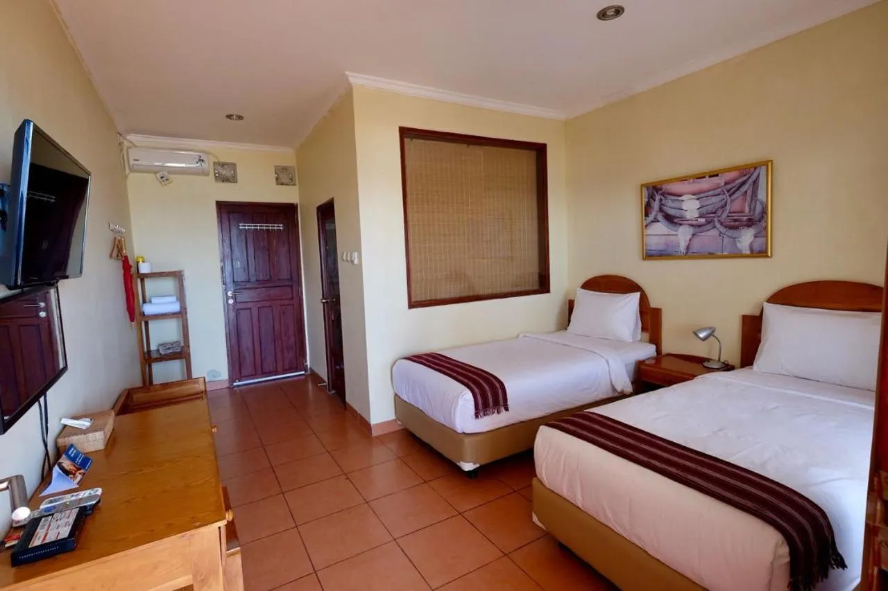 Bed in Mario Hotel and Cafe