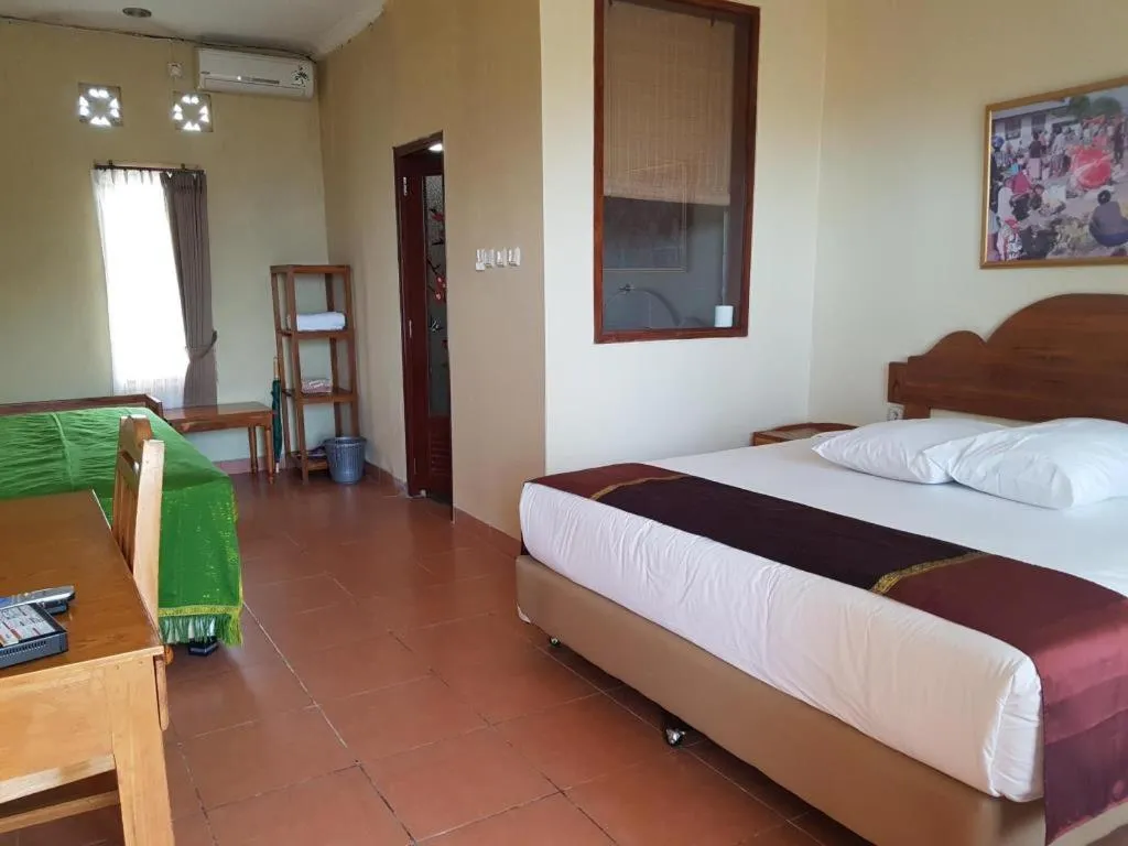 Bed in Mario Hotel and Cafe