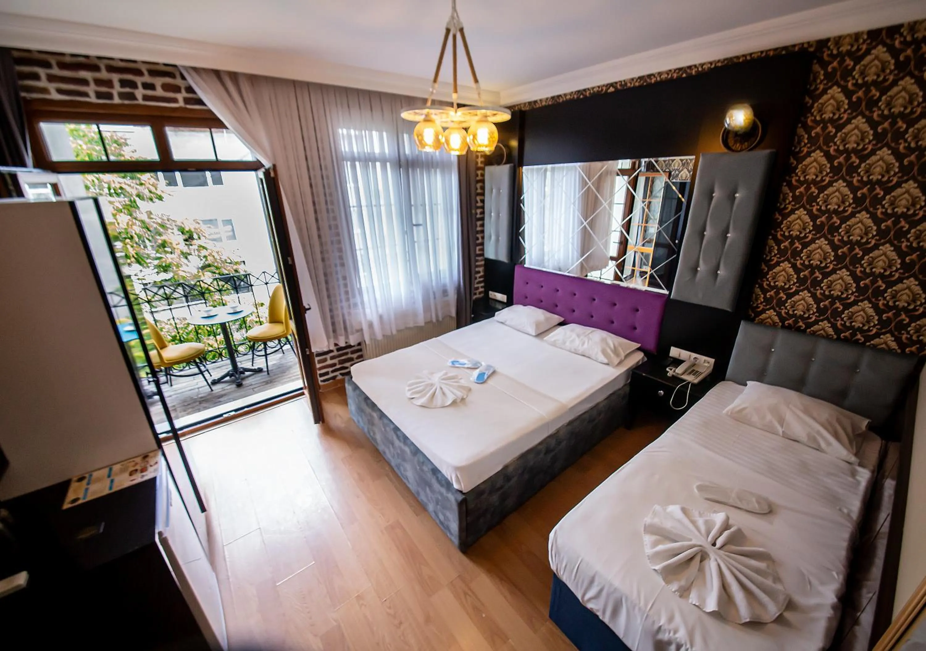 Bed in Royal Garden Suite and Hotel