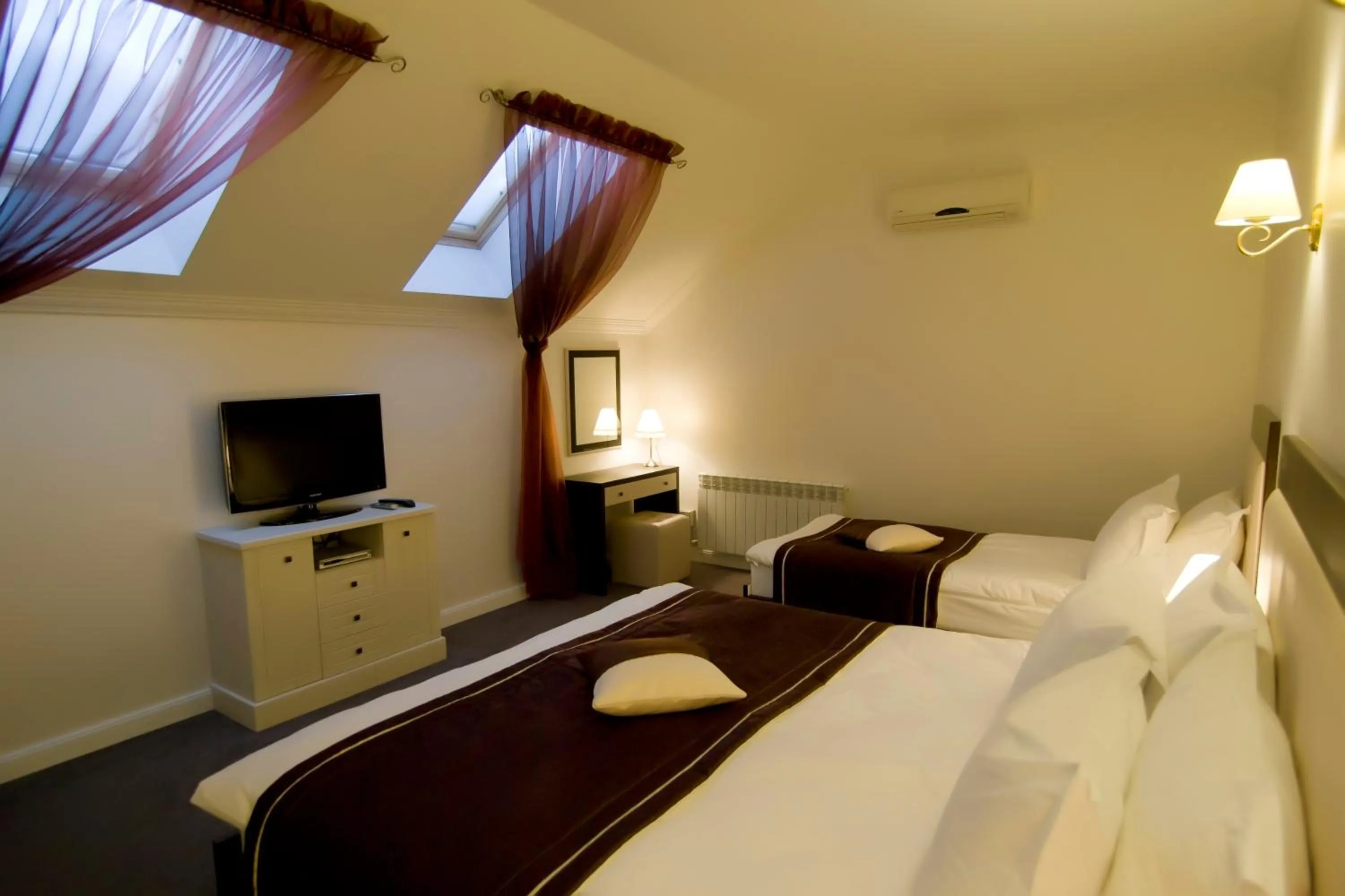 Bed in Villa Rossa Hotel
