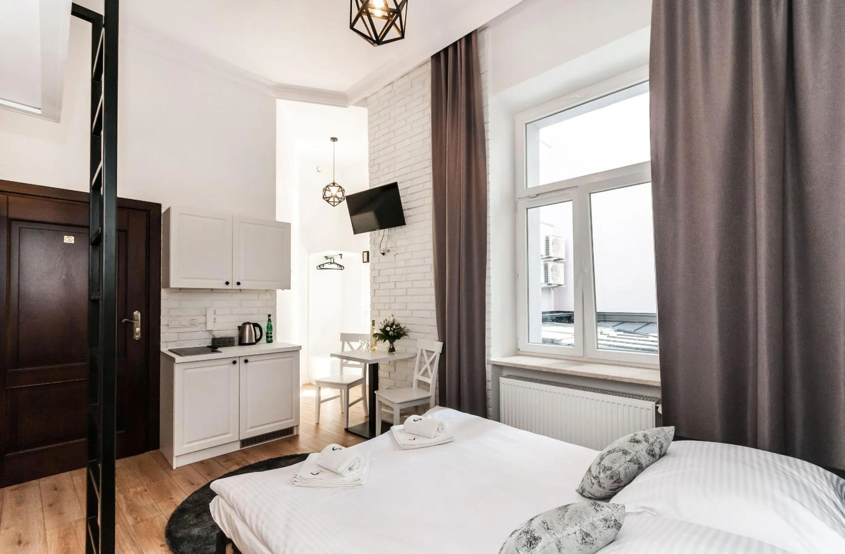 Kitchen or kitchenette, Bed in Apartamenty L5