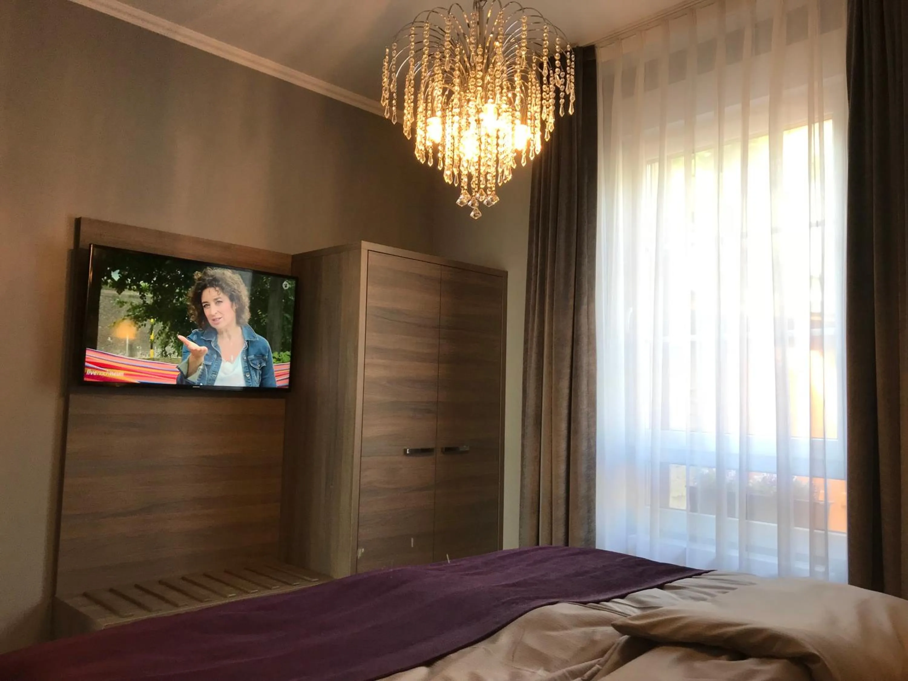 Bed in Apartmenthaus Burgenheimat in Rhens bei Koblenz