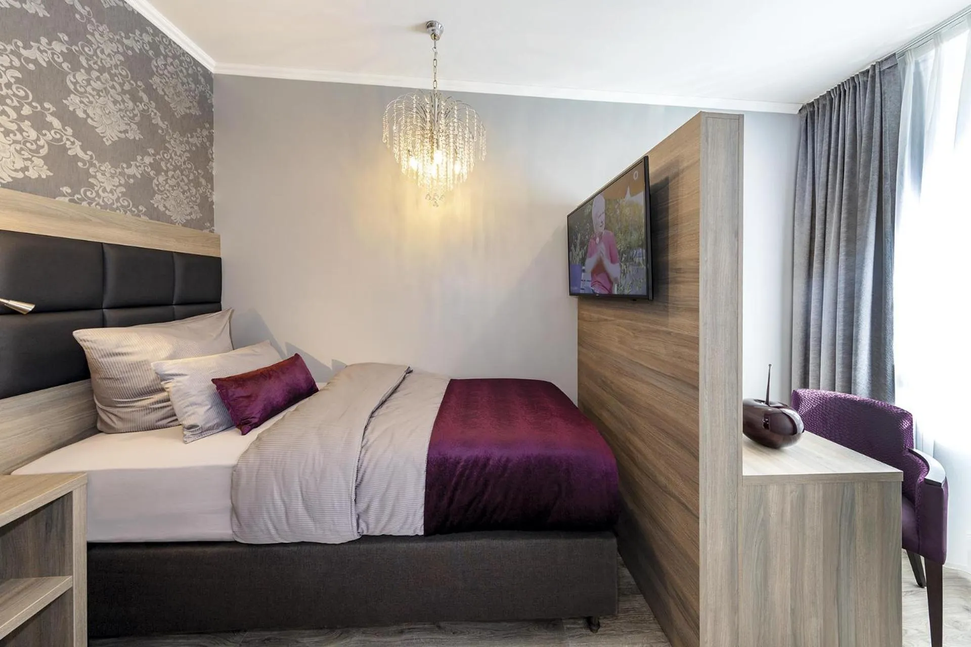 Bed in Apartmenthaus Burgenheimat in Rhens bei Koblenz