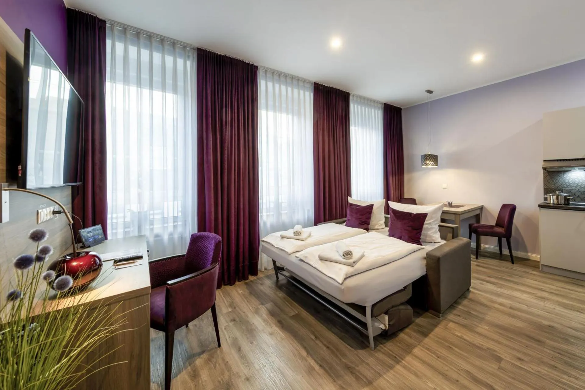 Bed in Apartmenthaus Burgenheimat in Rhens bei Koblenz