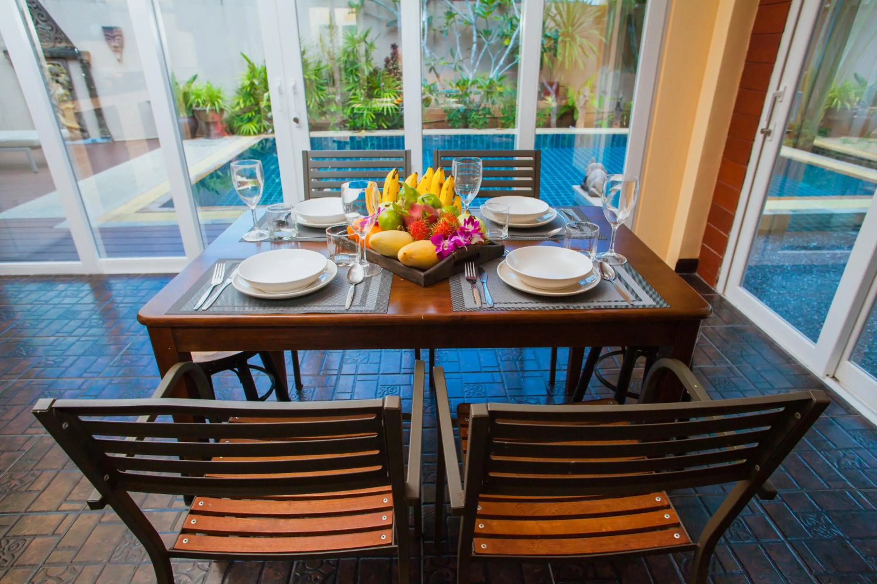 Dining area in Baan Manuchang Villa, SHA Certified